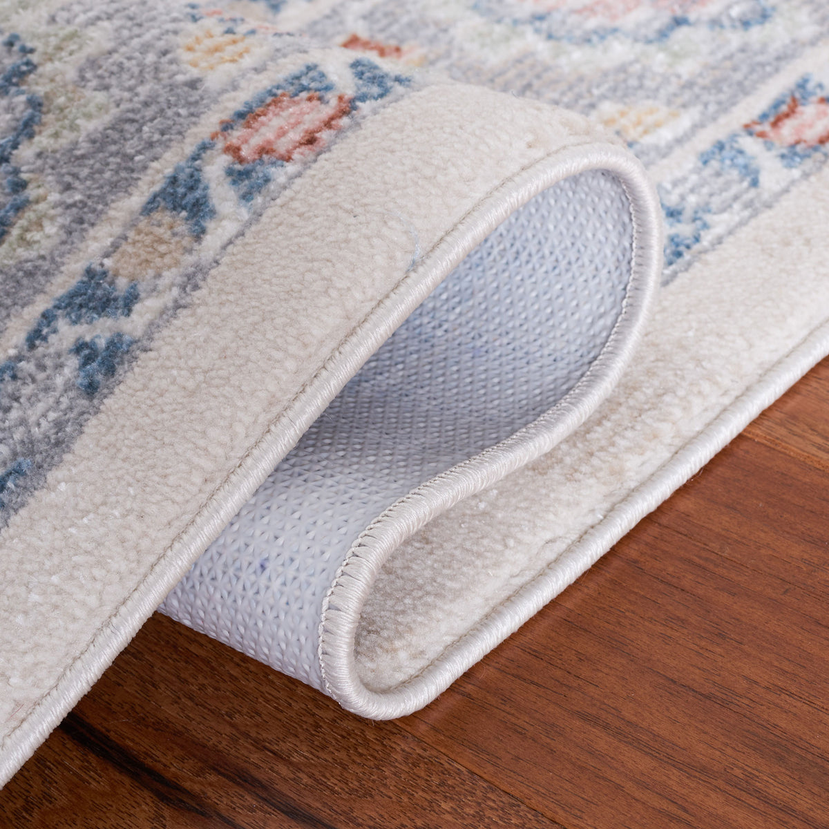 Flexible low-pile rug folds easily to reveal its softly textured backing. || BLR224B-5 || fold_room