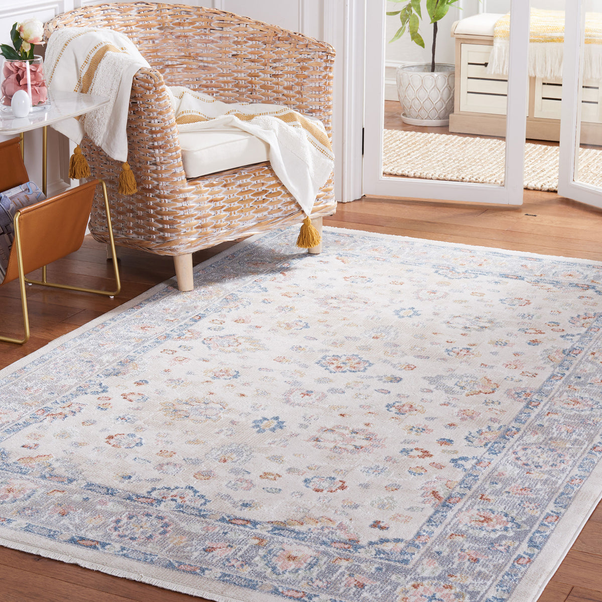 Classic beige and gray rug grounds the room with a soothing blue border and delicate florals. || BLR224B-5 || front_angle_room