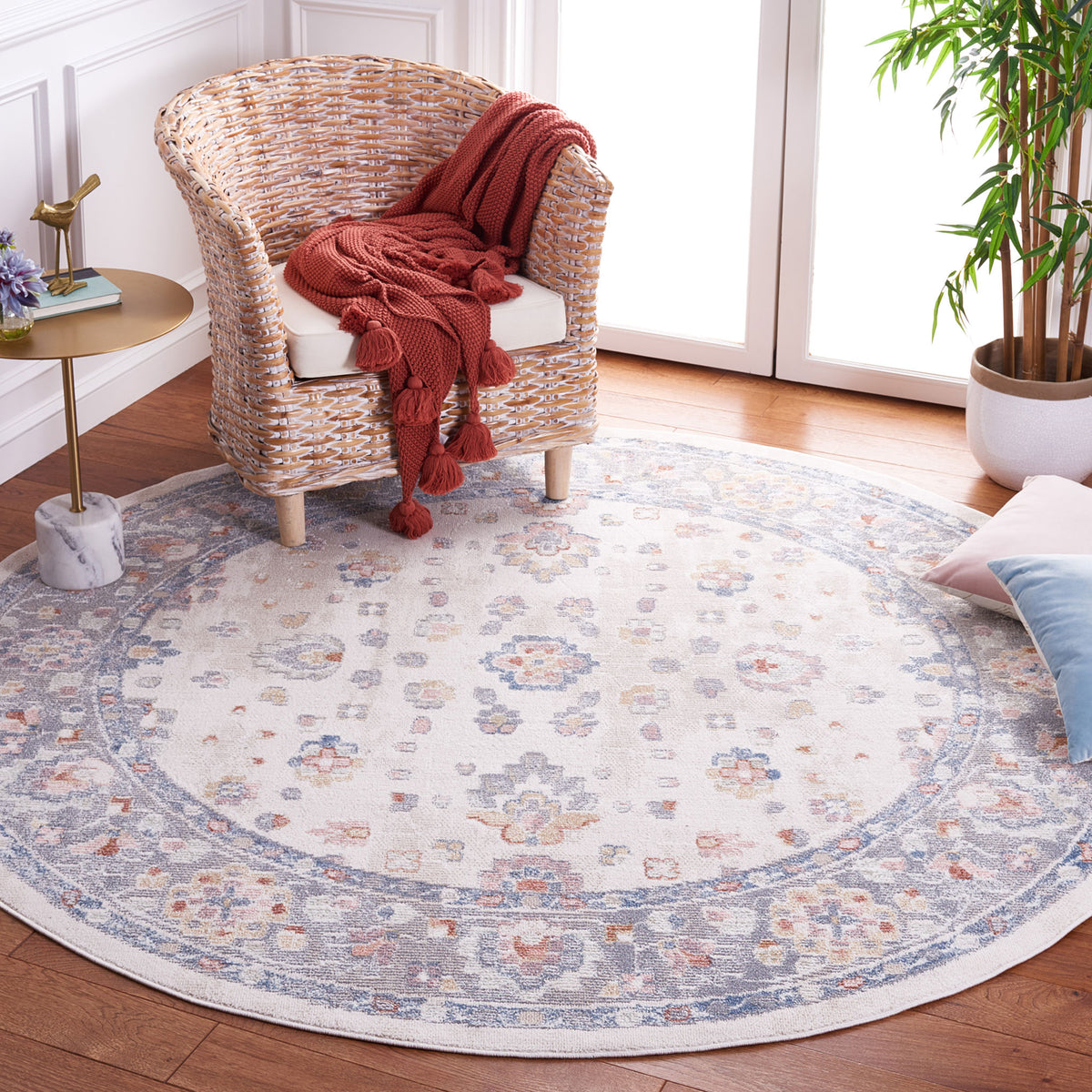 Vintage-inspired round rug in beige and gray with airy floral pattern and blue border || BLR224B-7R || top_room