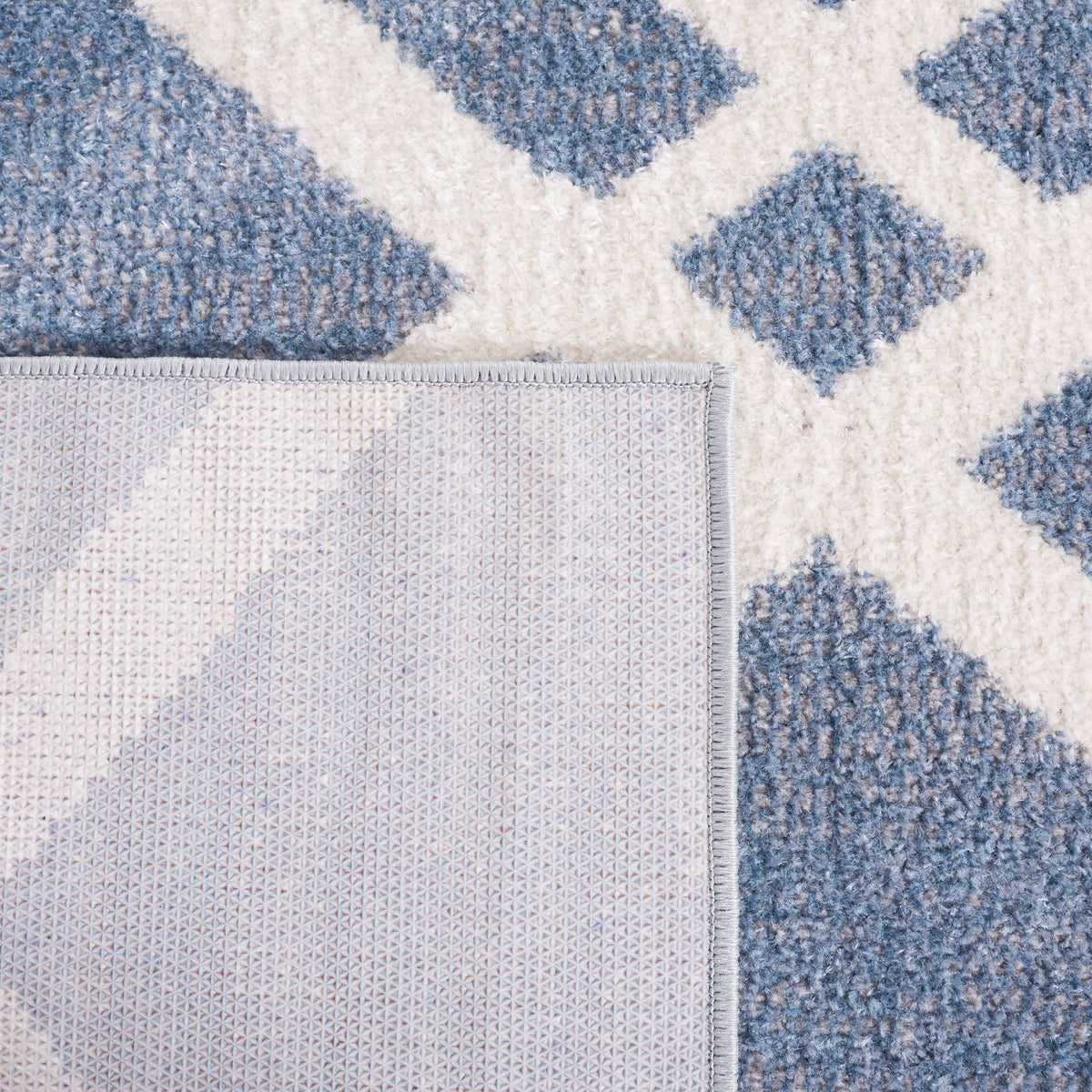 Folded corner reveals durable backing and neatly finished edging. || BLR228M-5 || backing_studio