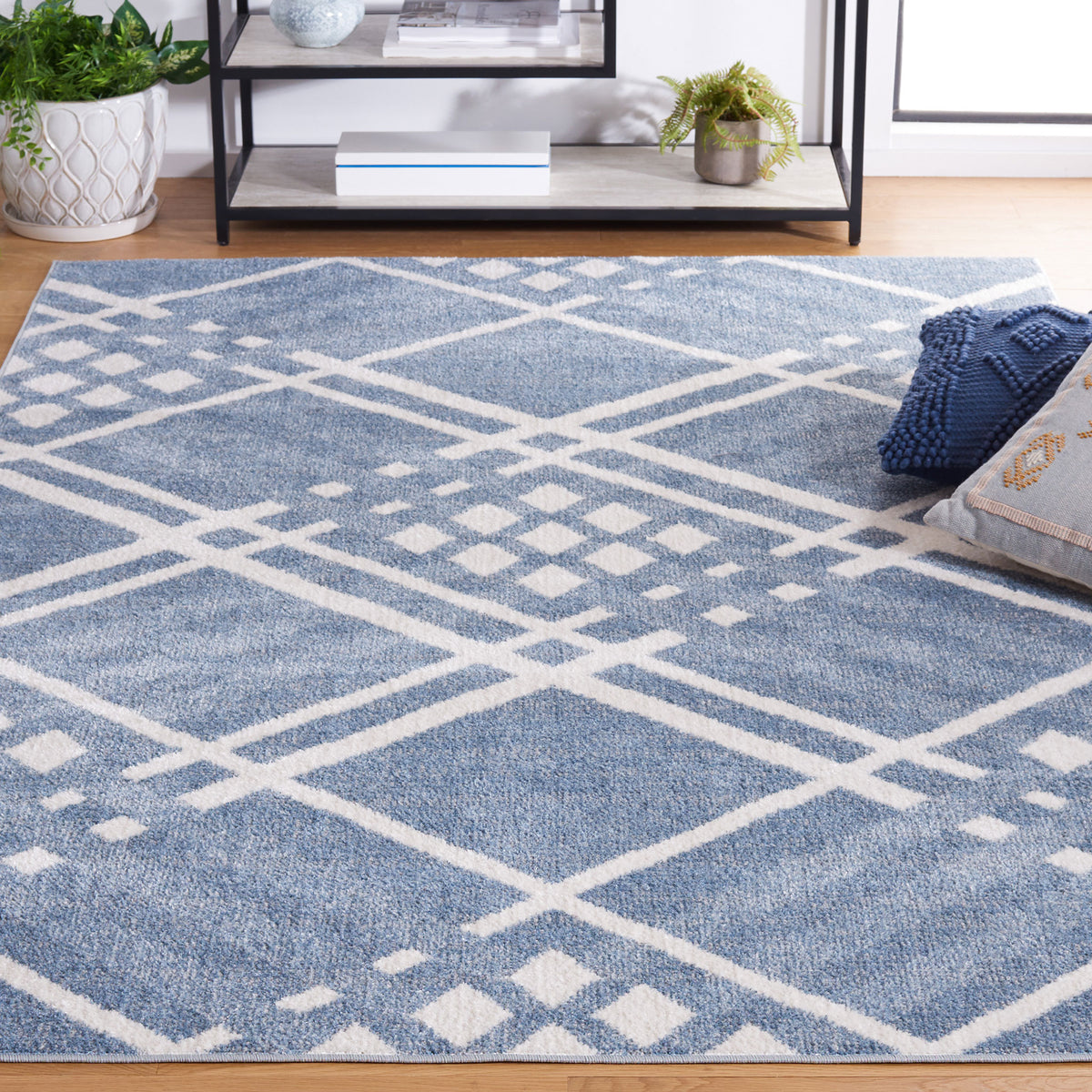 Modern blue and ivory lattice rug elevates the living area with plush texture and clean edges. || BLR228M-5 || front_angle_room
