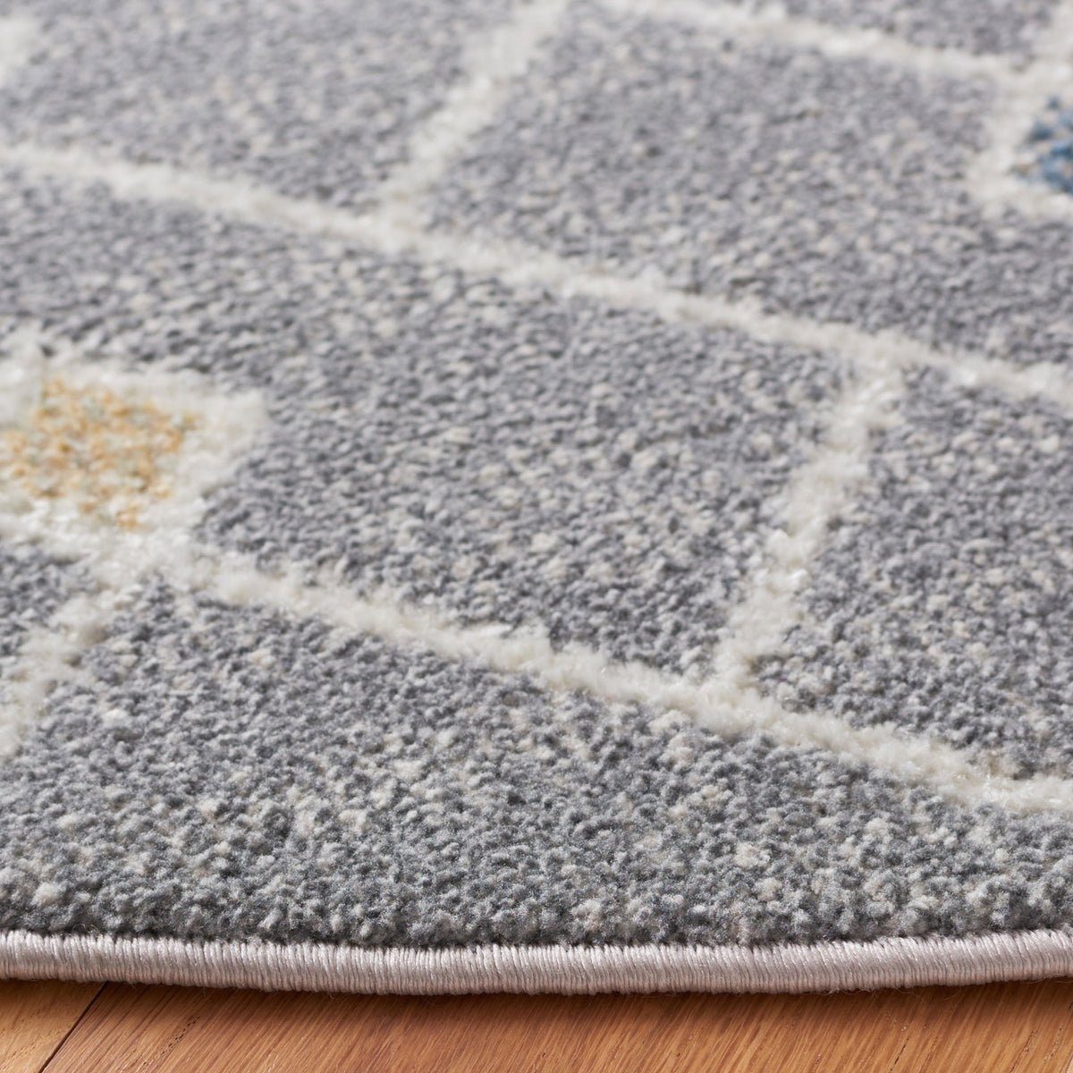 Textured gray weave with bound edge and raised herringbone pattern dotted by small multicolor diamonds || BLR230F-7R || detail_room