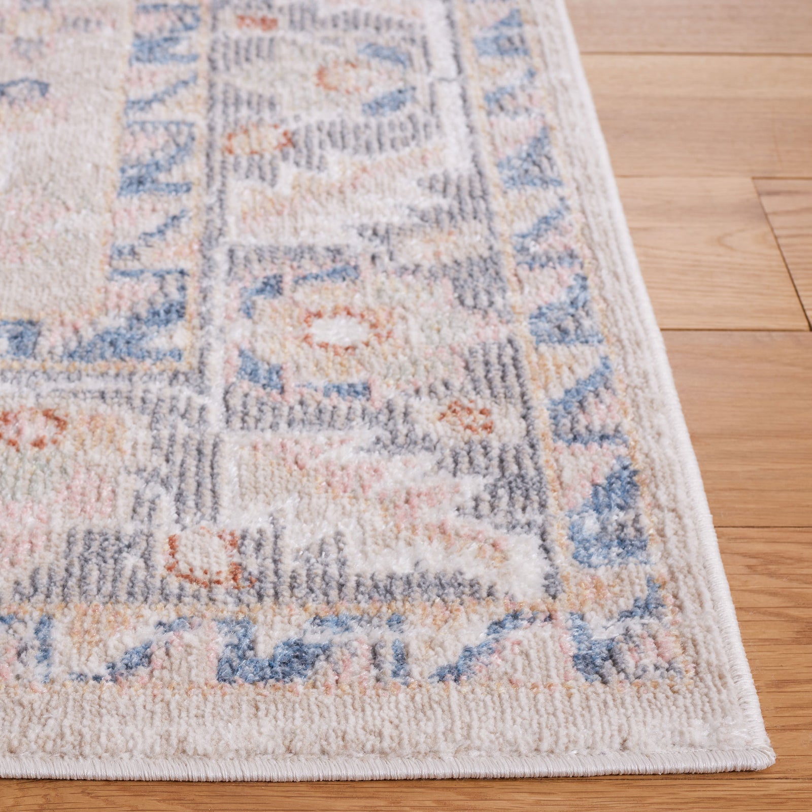 Beige and gray vintage-inspired rug with a soft pile and blue accents, framed by a classic floral border. || BLR232B-5 || top_studio