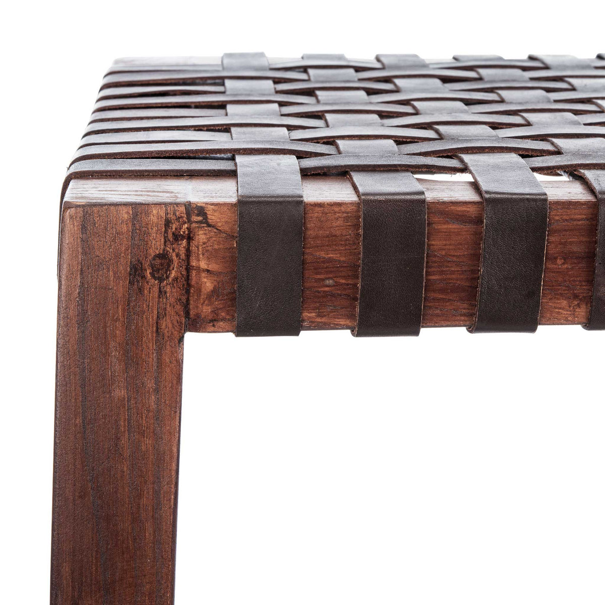 Smooth brown wood meets tightly woven leather at the seat's finished corner.