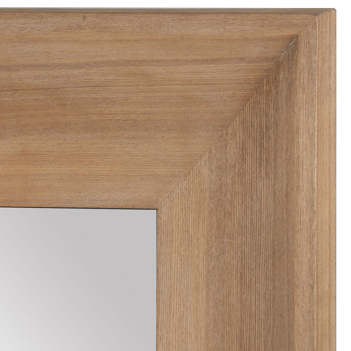 Fine wood-grain texture and mitered corners enrich the mirror's wide, natural-toned frame.