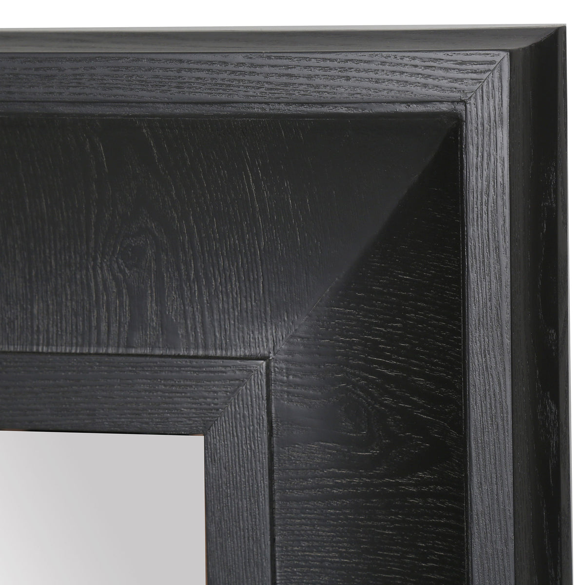 A mitered corner reveals the black wood-grain frame's broad, sloped surface. || CMI4007C || detail_studio