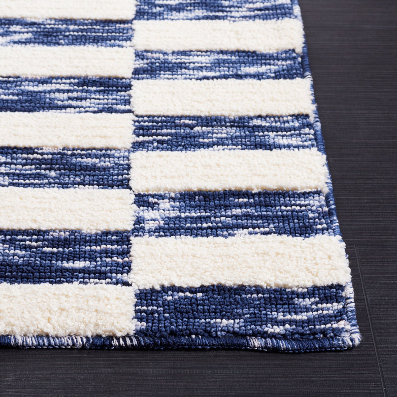 Serged edge highlights the plush navy and ivory weave and crisp checker pattern || ECR109N-5 || corner_room