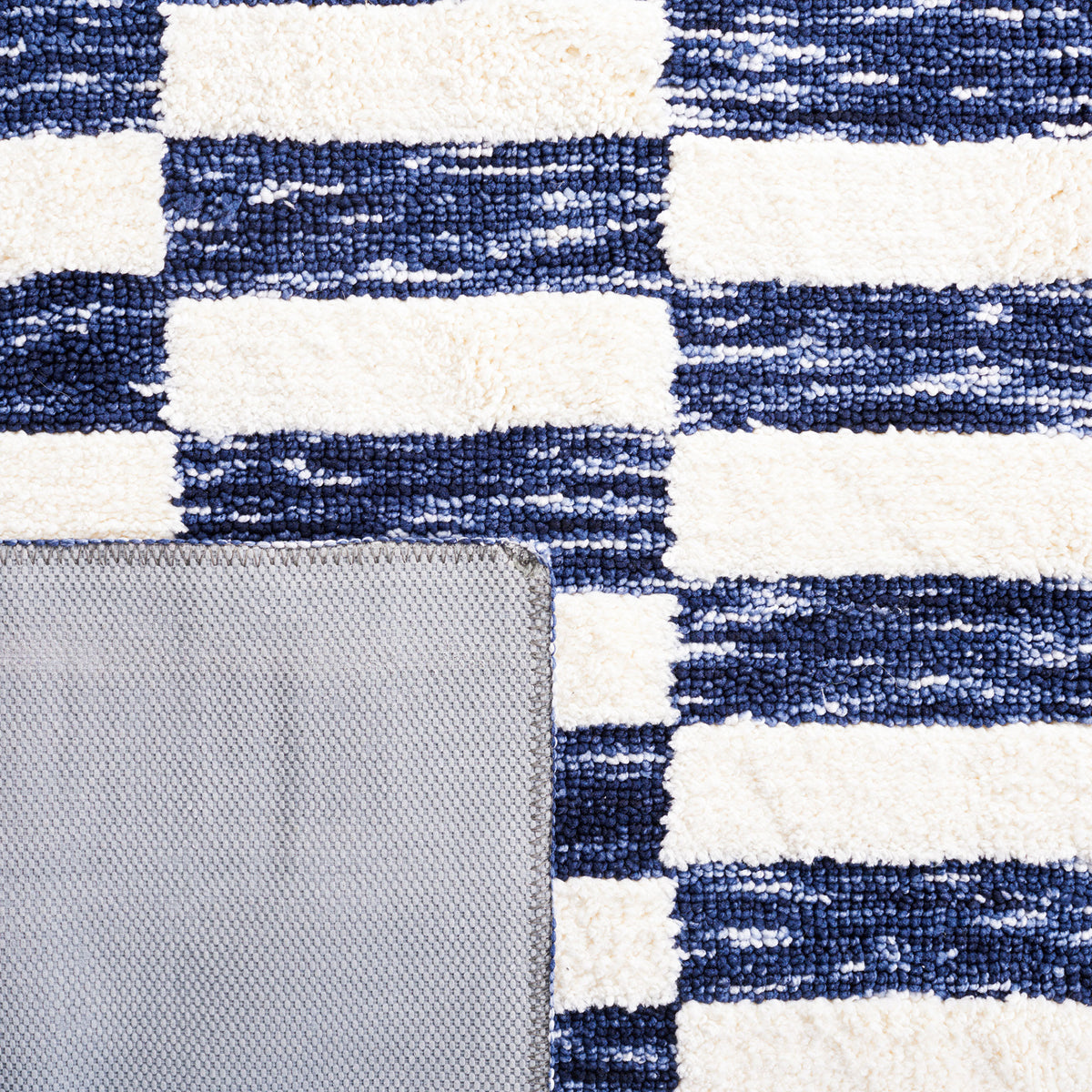 Navy and ivory weave with gray latex backing and neatly finished edges || ECR109N-5 || backing_studio