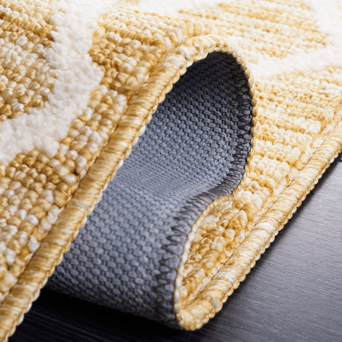 Folded edge shows gray backing and a dense, textured weave. || ECR113D-5 || fold_studio
