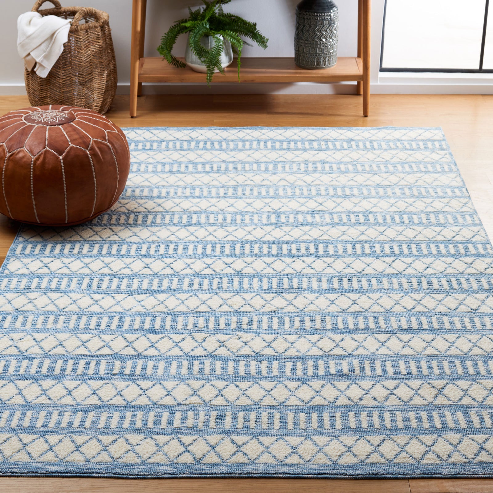 Airy ivory and blue rug layers soft texture and geometric pattern into the living space || ECR114A-5 || front_angle_room