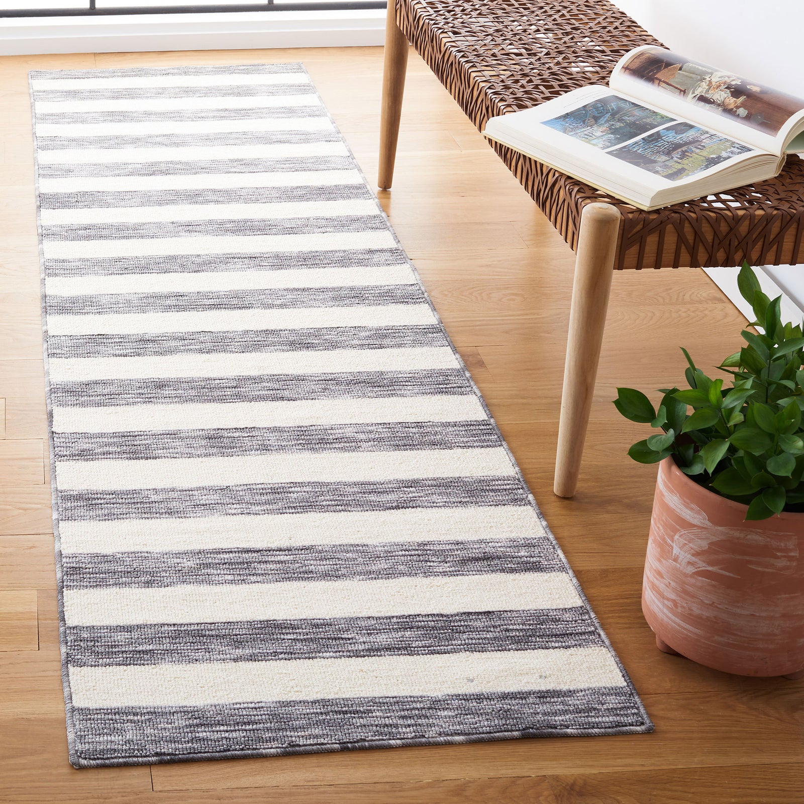 Runner rug in dark gray and ivory stripes, adding modern contrast and casual style to the entryway || ECR115H-28 || front_angle_room