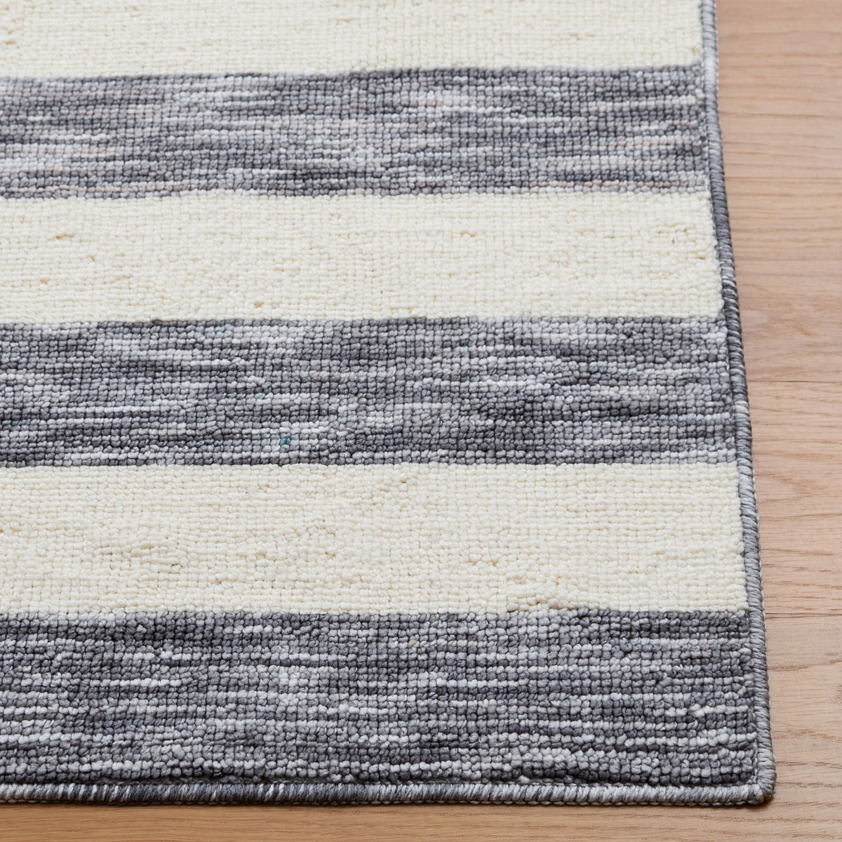 Finished edge and looped texture highlight the heathered gray and ivory stripes || ECR115H-5 || corner_room