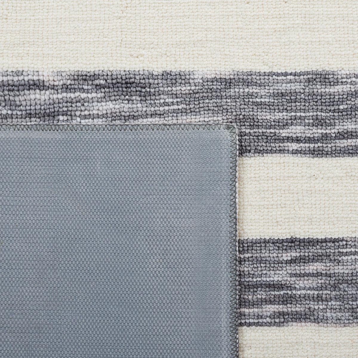 Corner flipped to show durable latex backing and tightly woven surface || ECR115H-5 || backing_room