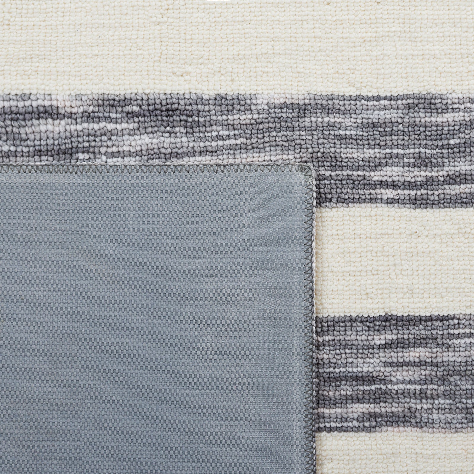 Corner flipped to show durable latex backing and tightly woven surface || ECR115H-5 || backing_room
