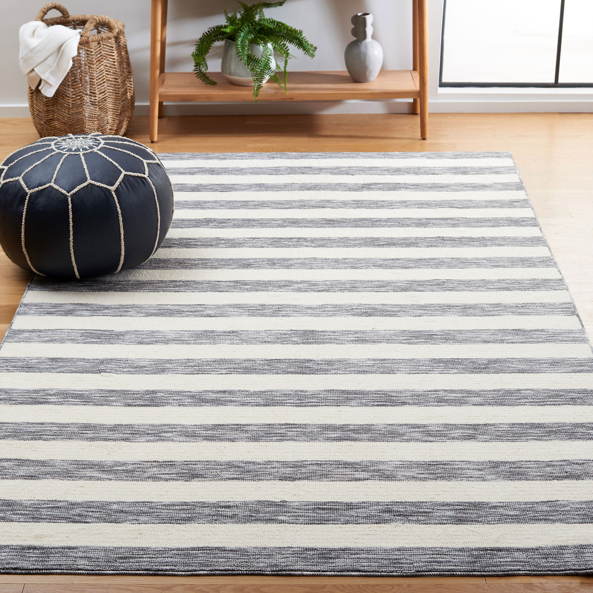 Soft gray and ivory striped rug brightens the room with easygoing, coastal style || ECR115H-5 || front_angle_room