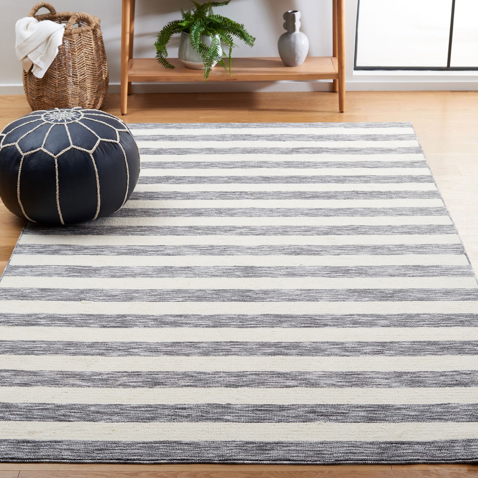 Soft gray and ivory striped rug brightens the room with easygoing, coastal style || ECR115H-5 || front_angle_room
