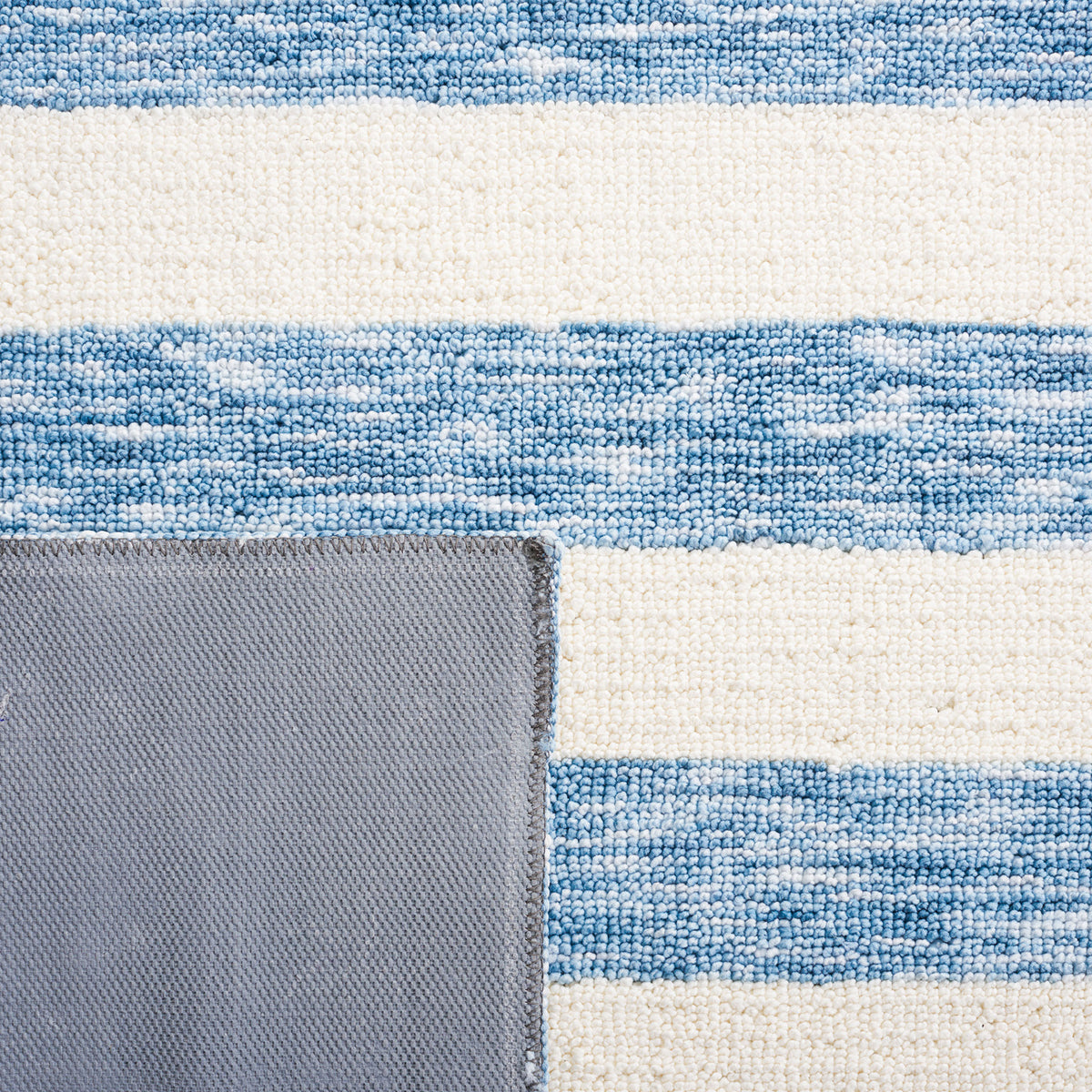 Close-up of the striped surface and sturdy underside highlights everyday-friendly construction || ECR115L-5 || backing_studio