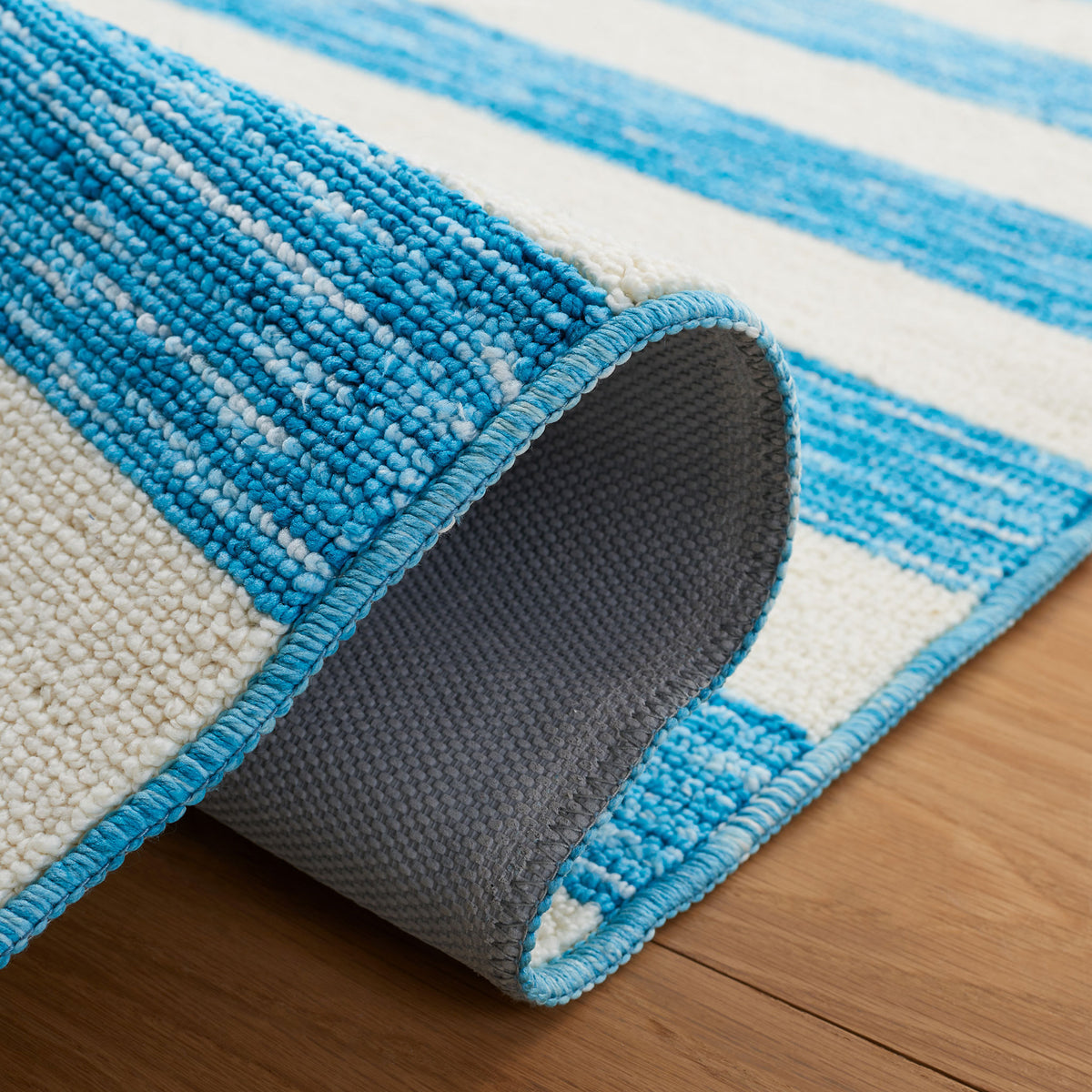 Curved edge reveals durable backing and a soft, nubby pile || ECR115M-5 || fold_room