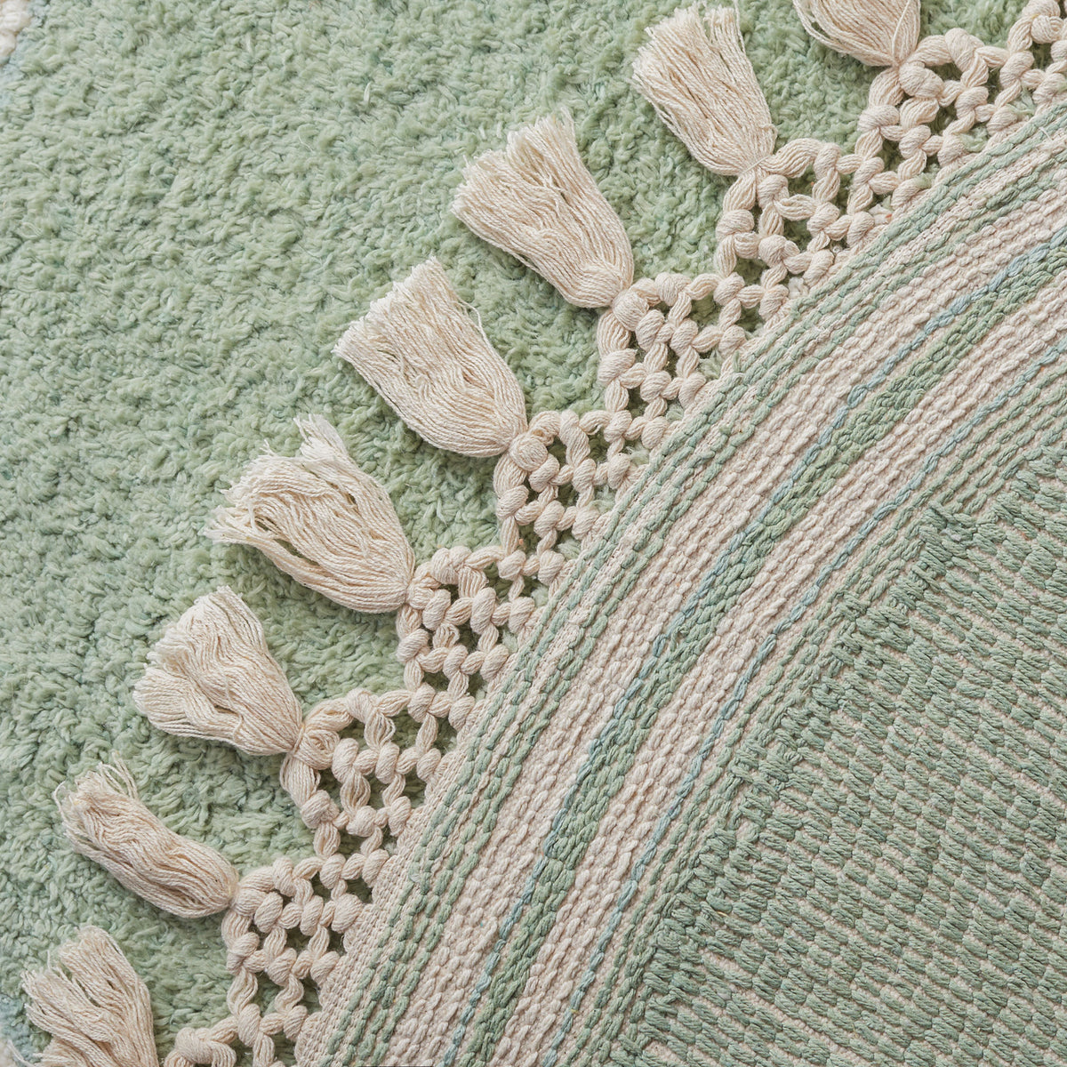 Tassel fringe and woven underside highlight the rug's craftsmanship and durable construction. || ECR201J-3R || backing_studio