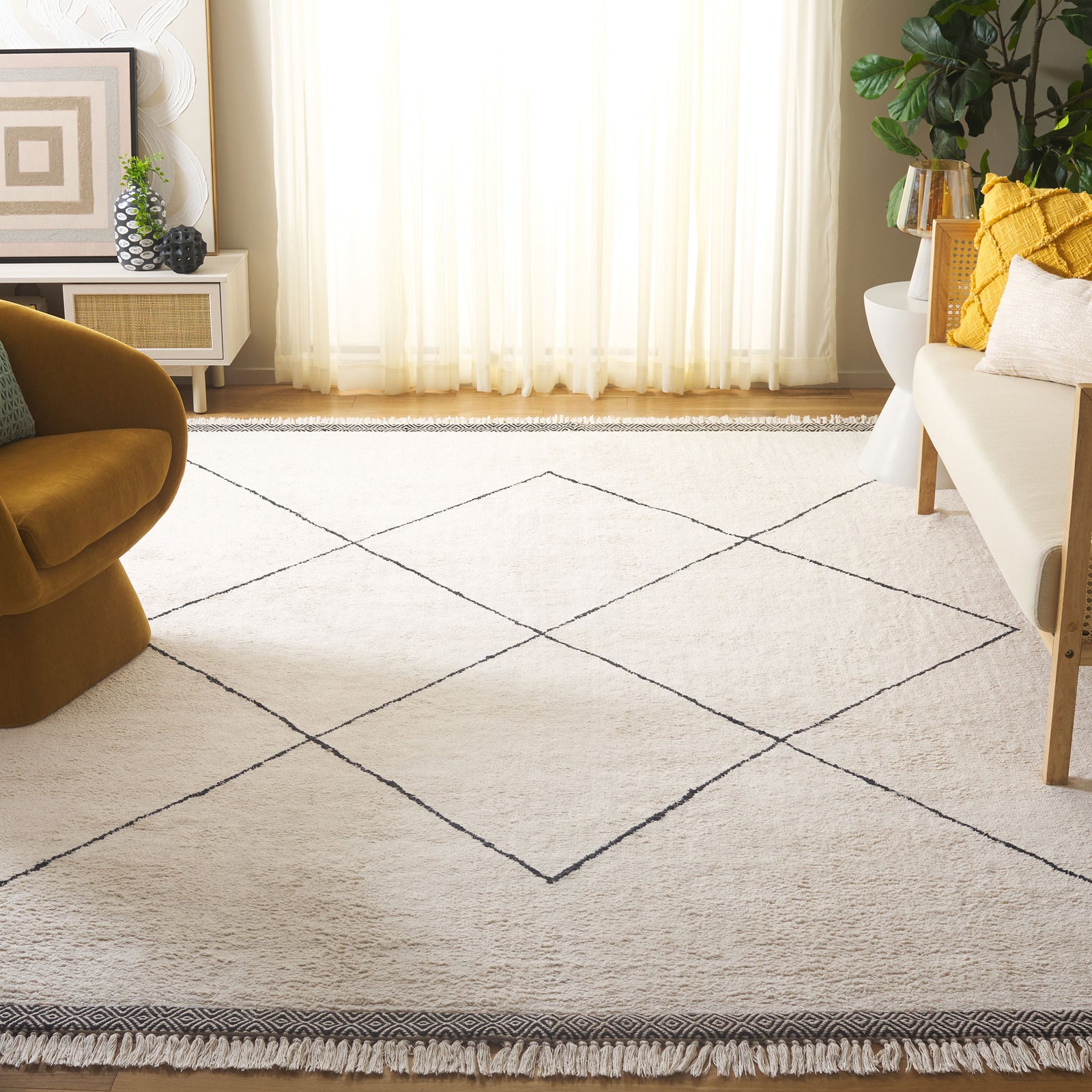 Elevated ivory rug grounds the room with bold diamond lines and tassel-trimmed edges || ECR210A-8 || front_angle_room