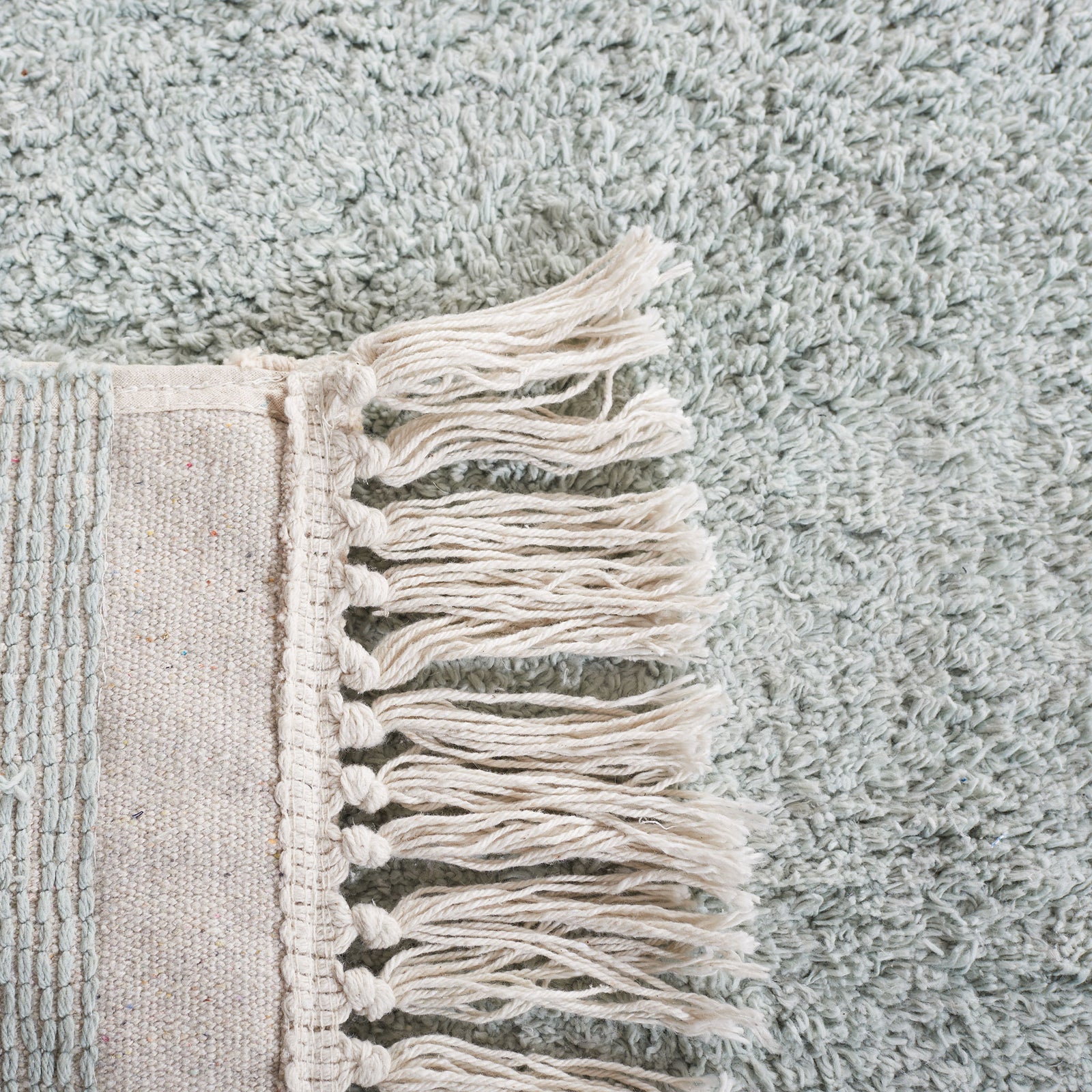 Woven backing and tidy fringe showcase thoughtful craftsmanship and durability || ECR211J-5 || backing_room