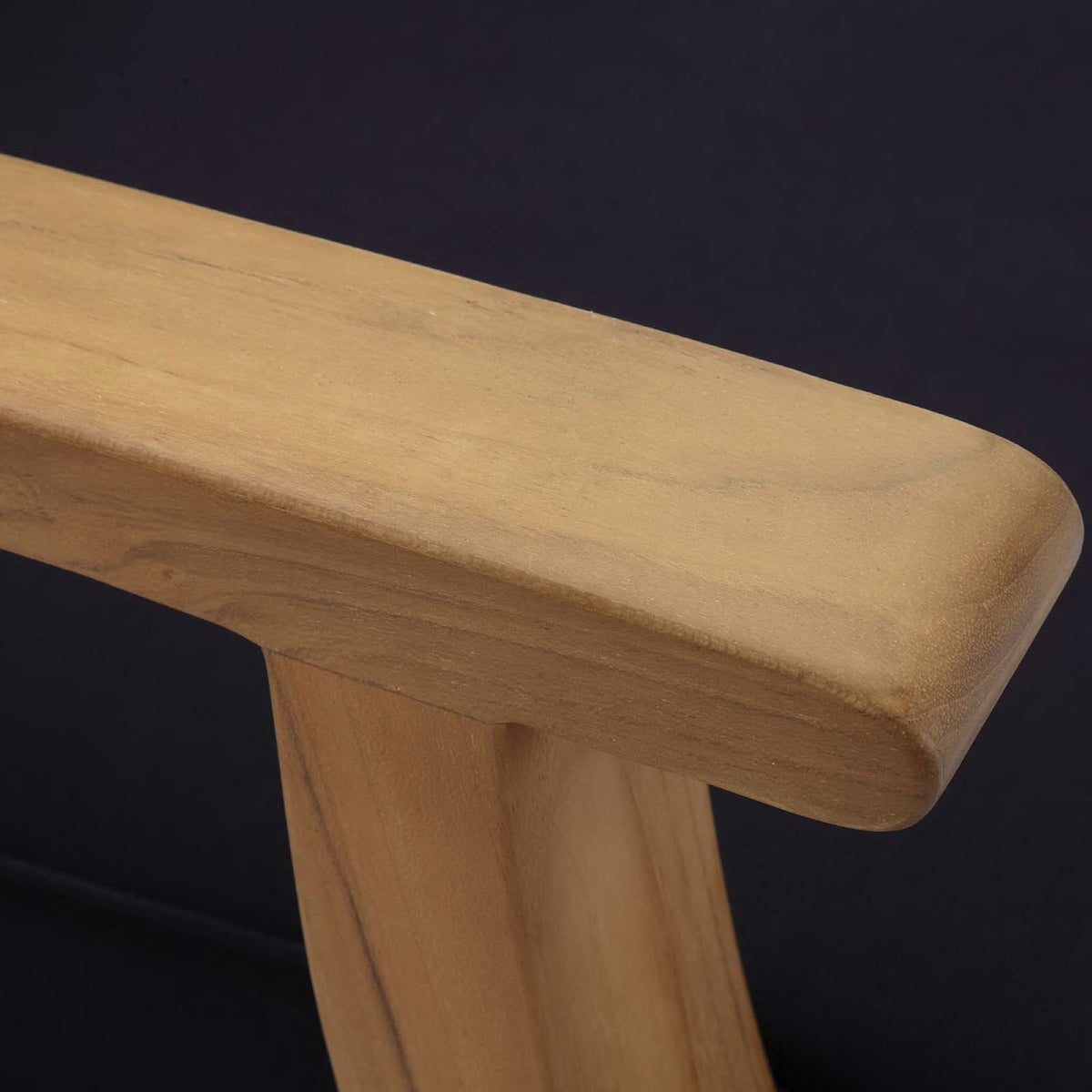 Smooth teak armrest showcases refined wood grain against the rich navy cushions || EEI-1144-NAT-NAV-SET || detail_studio