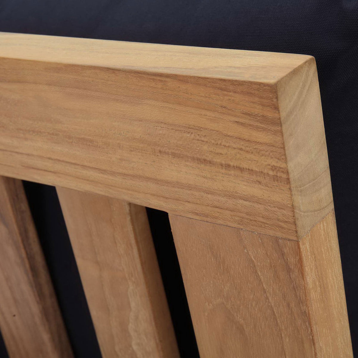 Close-grain teak back rail detail standing out against dark navy upholstery || EEI-1150-NAT-NAV-SET || detail_studio