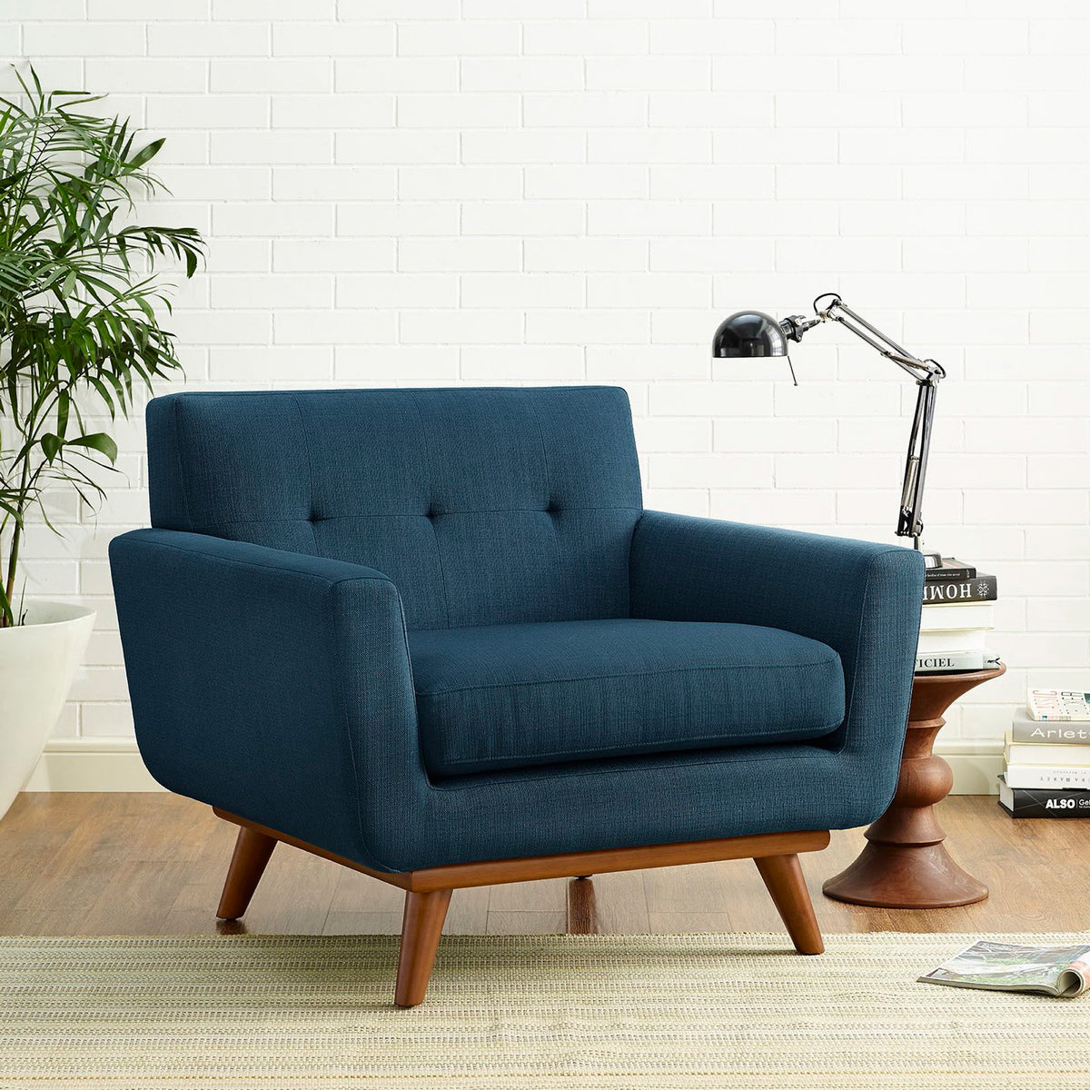 Deep blue upholstery and button tufting bring color and comfort to a living space.