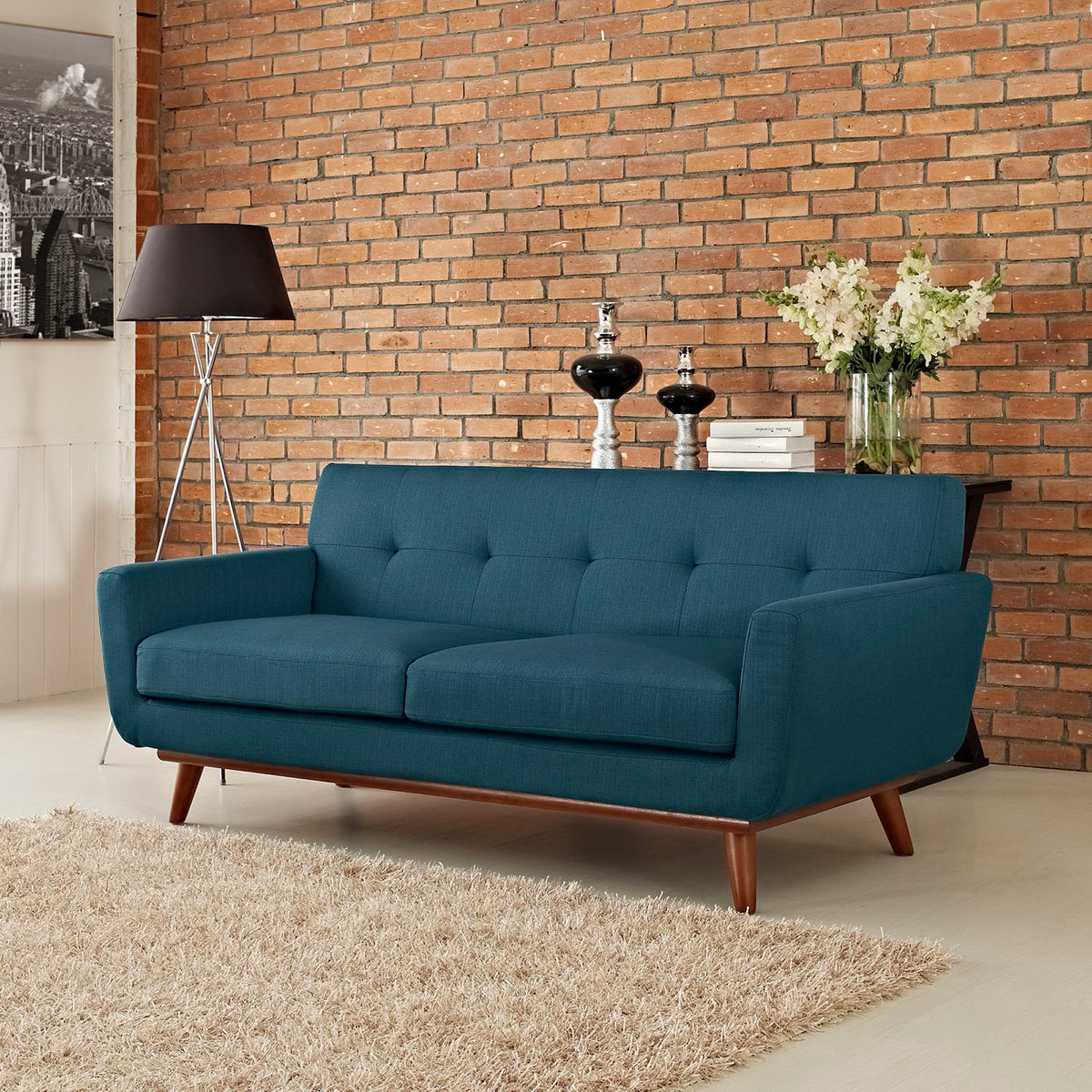 Azure loveseat brings inviting tufted comfort and warm wood accents to the living room