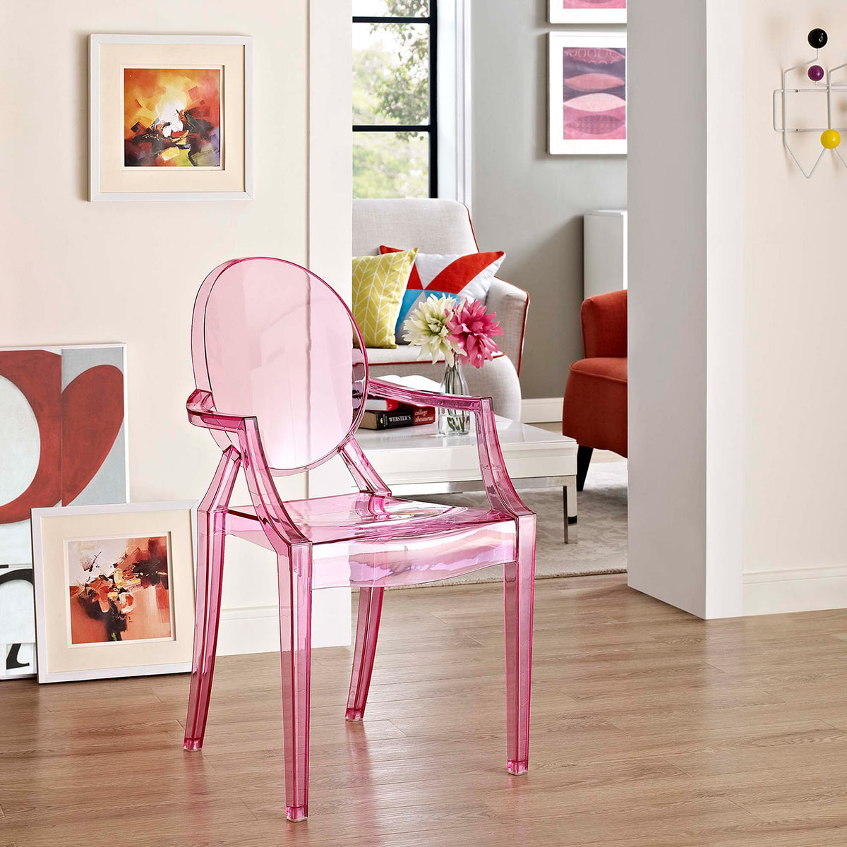 Translucent pink seat brings a playful pop of color to a bright, contemporary living area