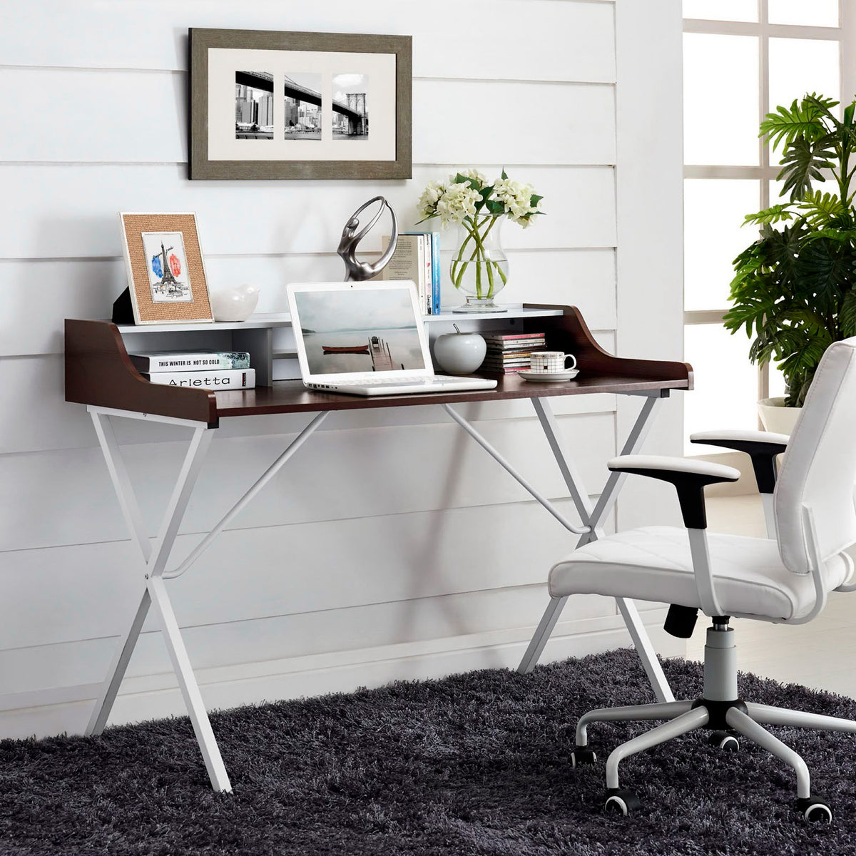 Open cubbies keep books and supplies close at hand above a cherry-finish work surface.