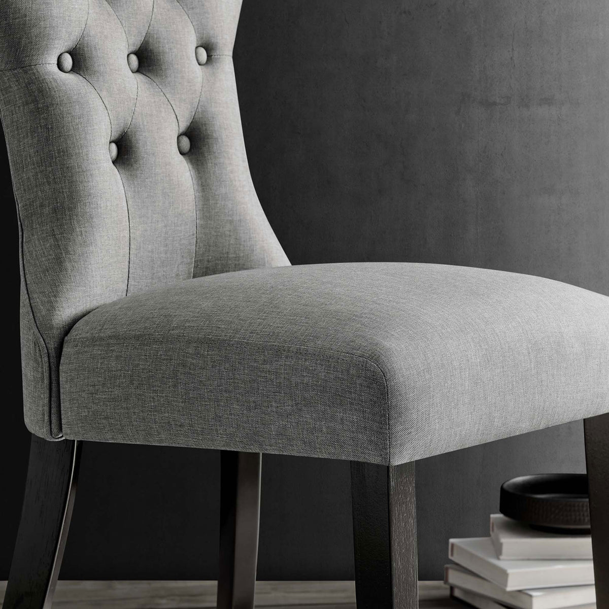 Light gray dining chair seat and lower back with soft woven texture beside dark wood legs || EEI-1380-LGR || detail_room