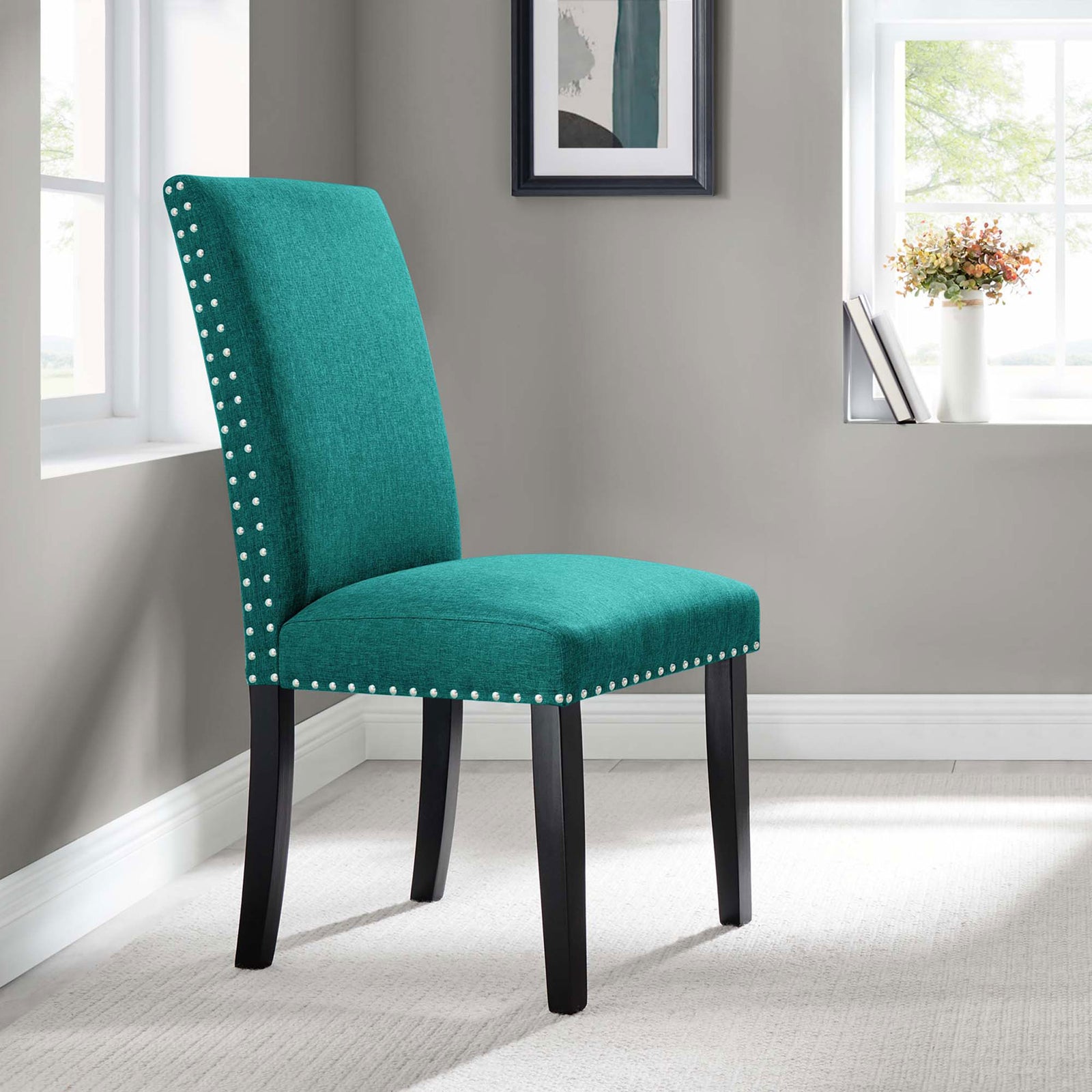 Teal upholstered dining chair styled in a modern dining nook with soft natural light and neutral decor || EEI-1384-TEA || front_angle_room