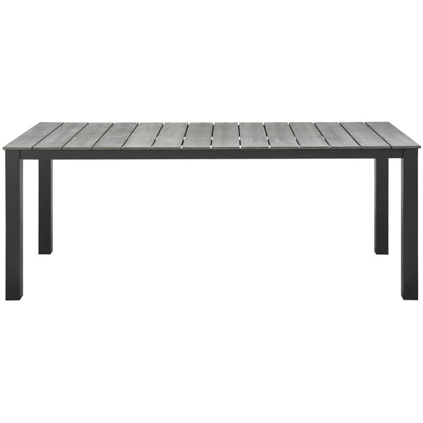 Long brown-gray outdoor dining table with wide gray planks and powder-coated metal frame. || EEI-1509-BRN-GRY || front_studio