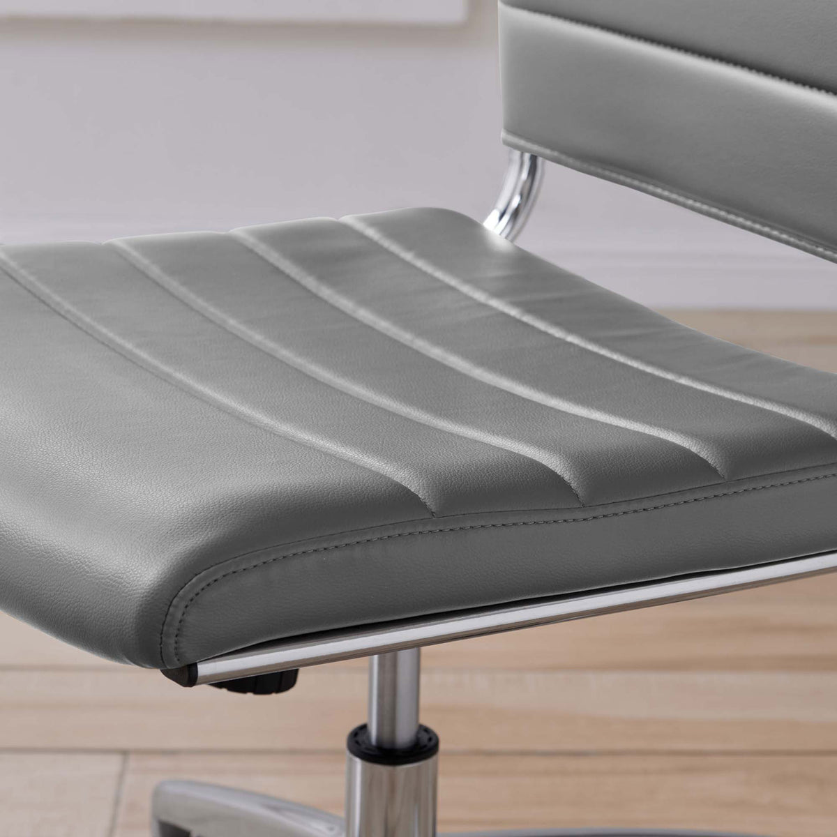 Gray ribbed seat cushion with soft vinyl upholstery and subtle sheen styled over light wood flooring || EEI-1525-GRY || detail_room