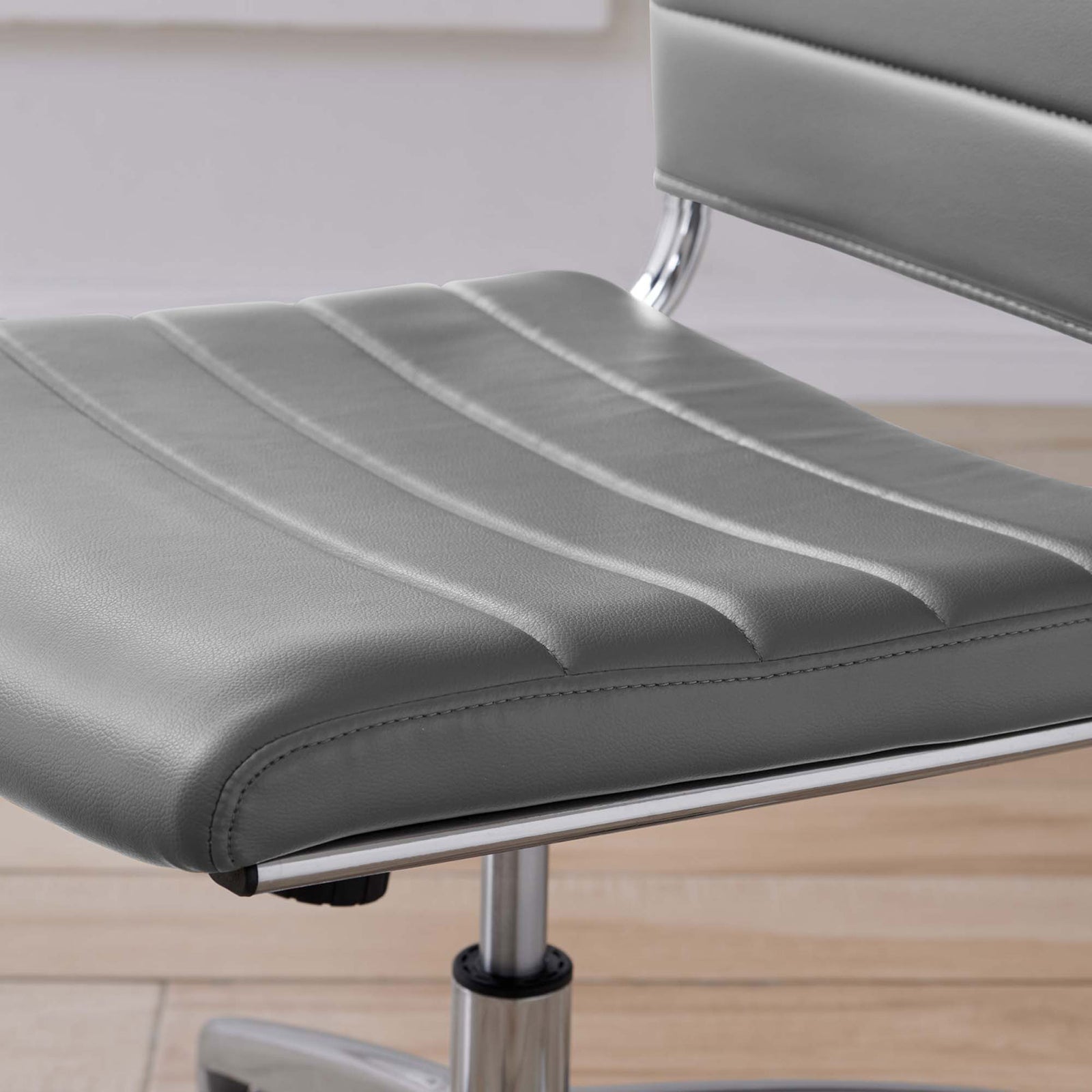 Gray ribbed seat cushion with soft vinyl upholstery and subtle sheen styled over light wood flooring || EEI-1525-GRY || detail_room