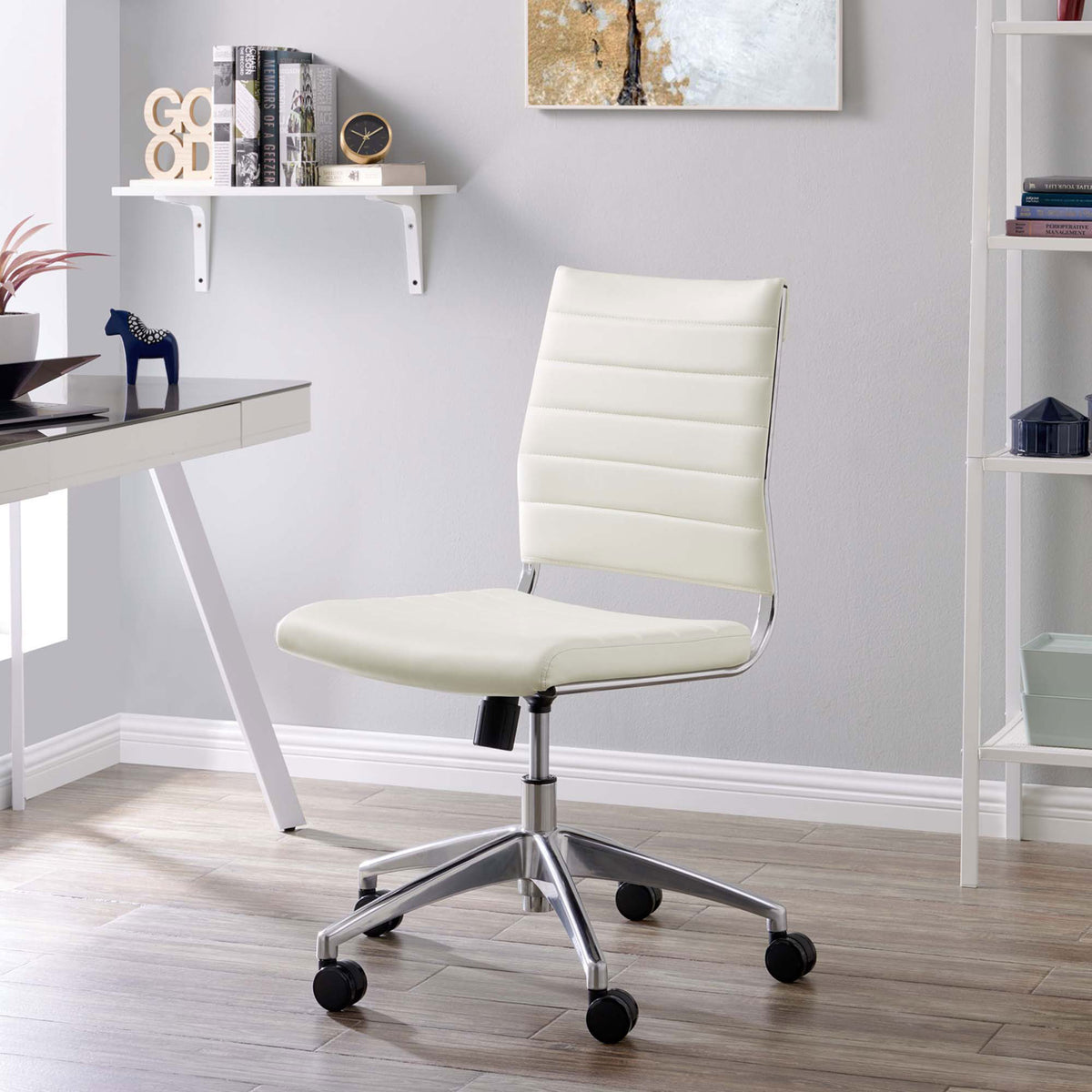 White armless office chair styled in a contemporary home office with sleek chrome base. || EEI-1525-WHI || front_angle_room