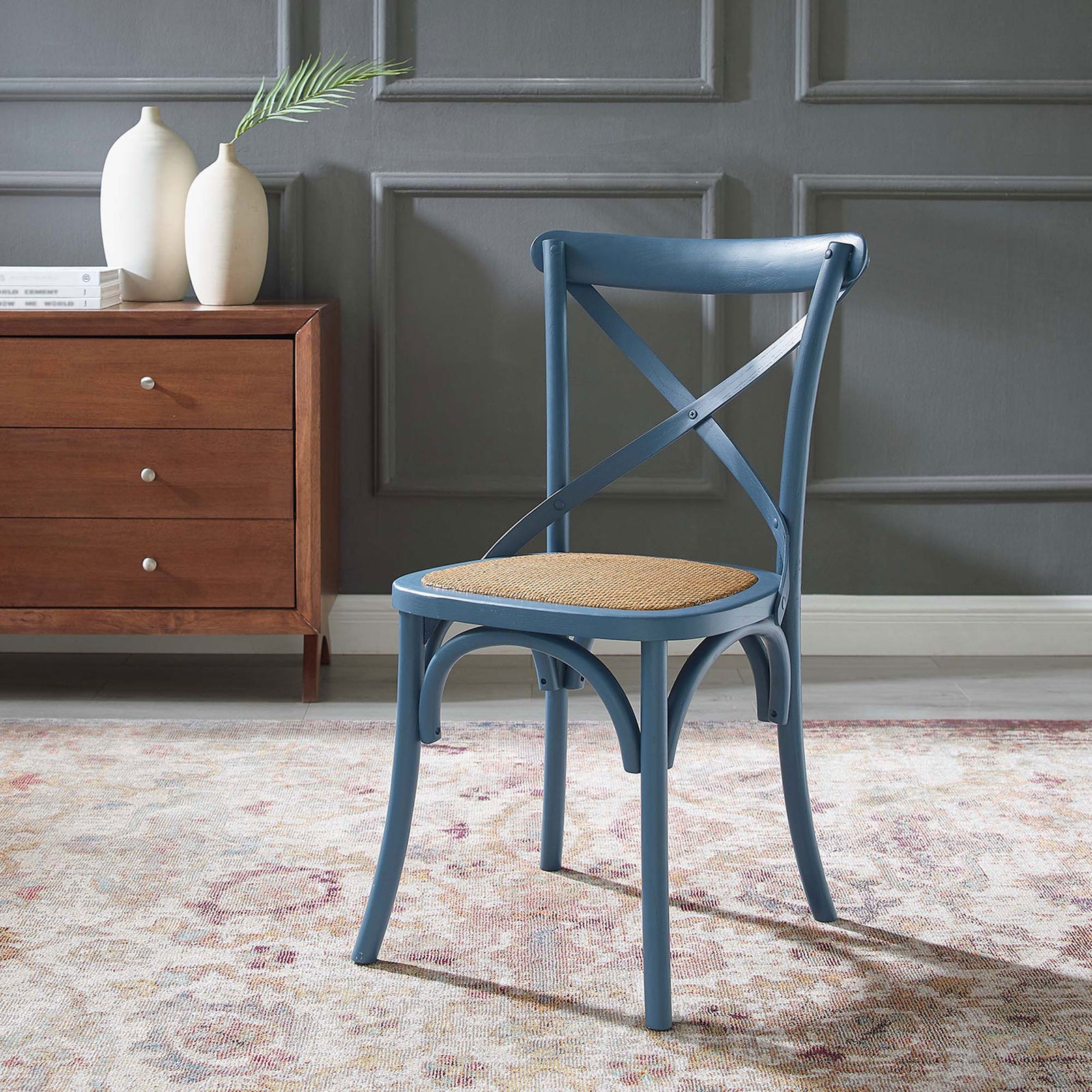 Harbor blue cross-back dining chair styled in a cozy room with patterned rug and wood credenza || EEI-1541-HAR || front_angle_room