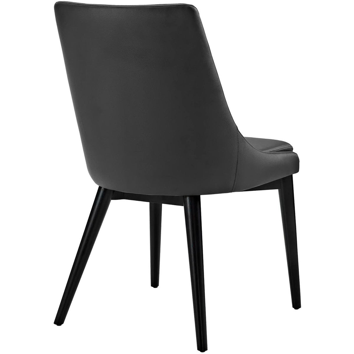 Black vegan leather covers the rounded chair back above slim, dark wooden legs.