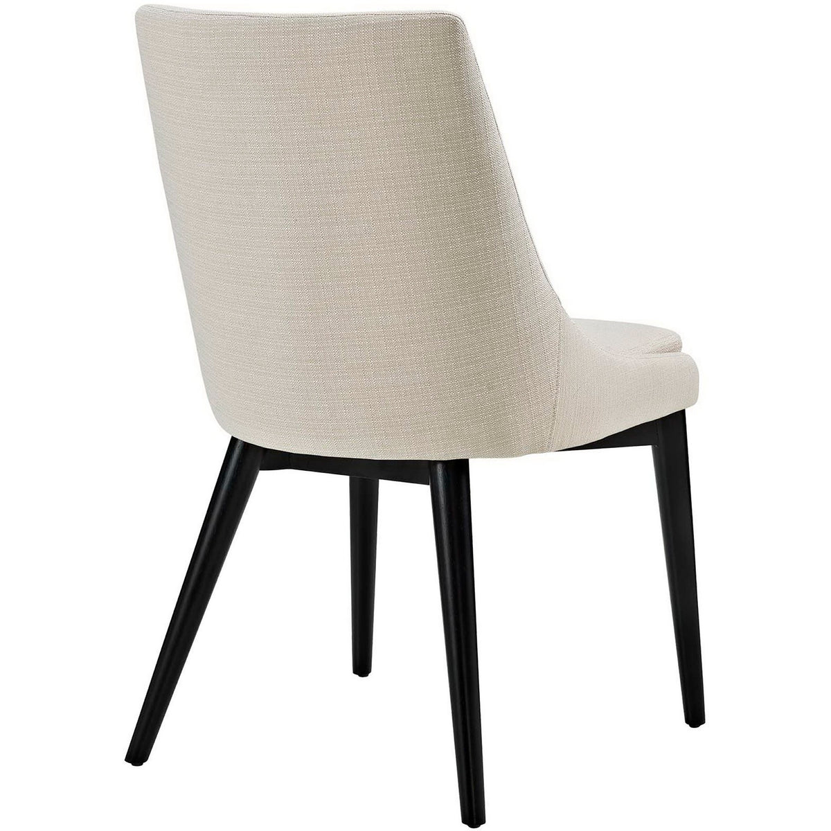 Soft beige fabric covers the smooth, wraparound back above slender black legs.
