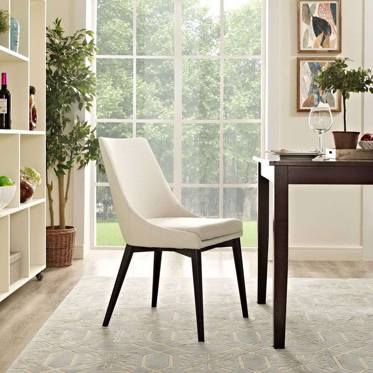 A neutral beige chair pairs a tall upholstered back with a plush seat for relaxed dining.
