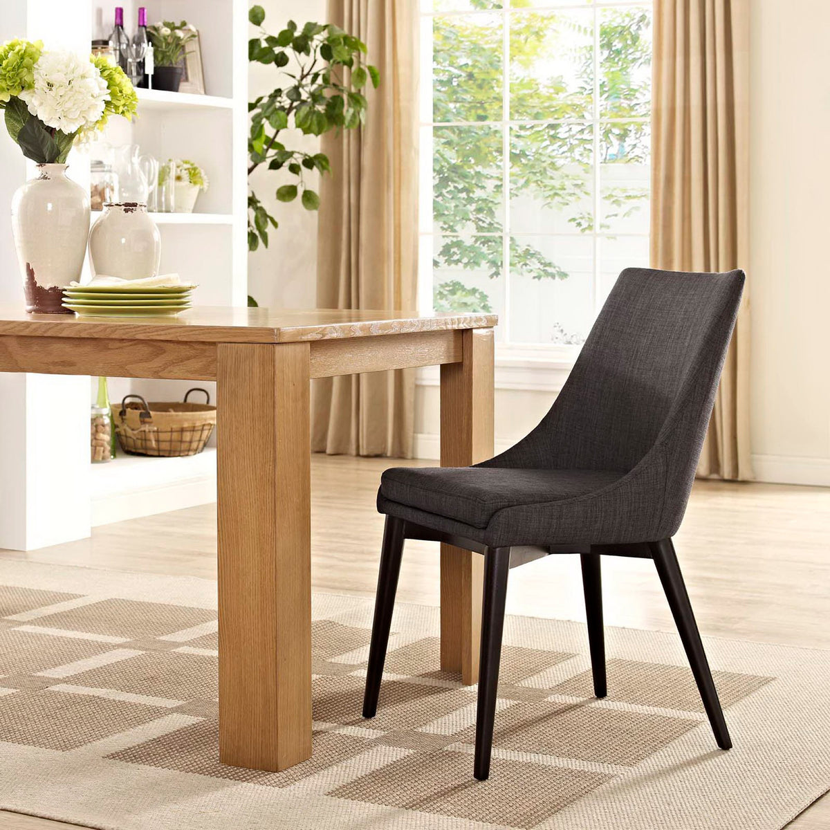 Rich brown fabric and a streamlined shape bring modern comfort to the dining table.