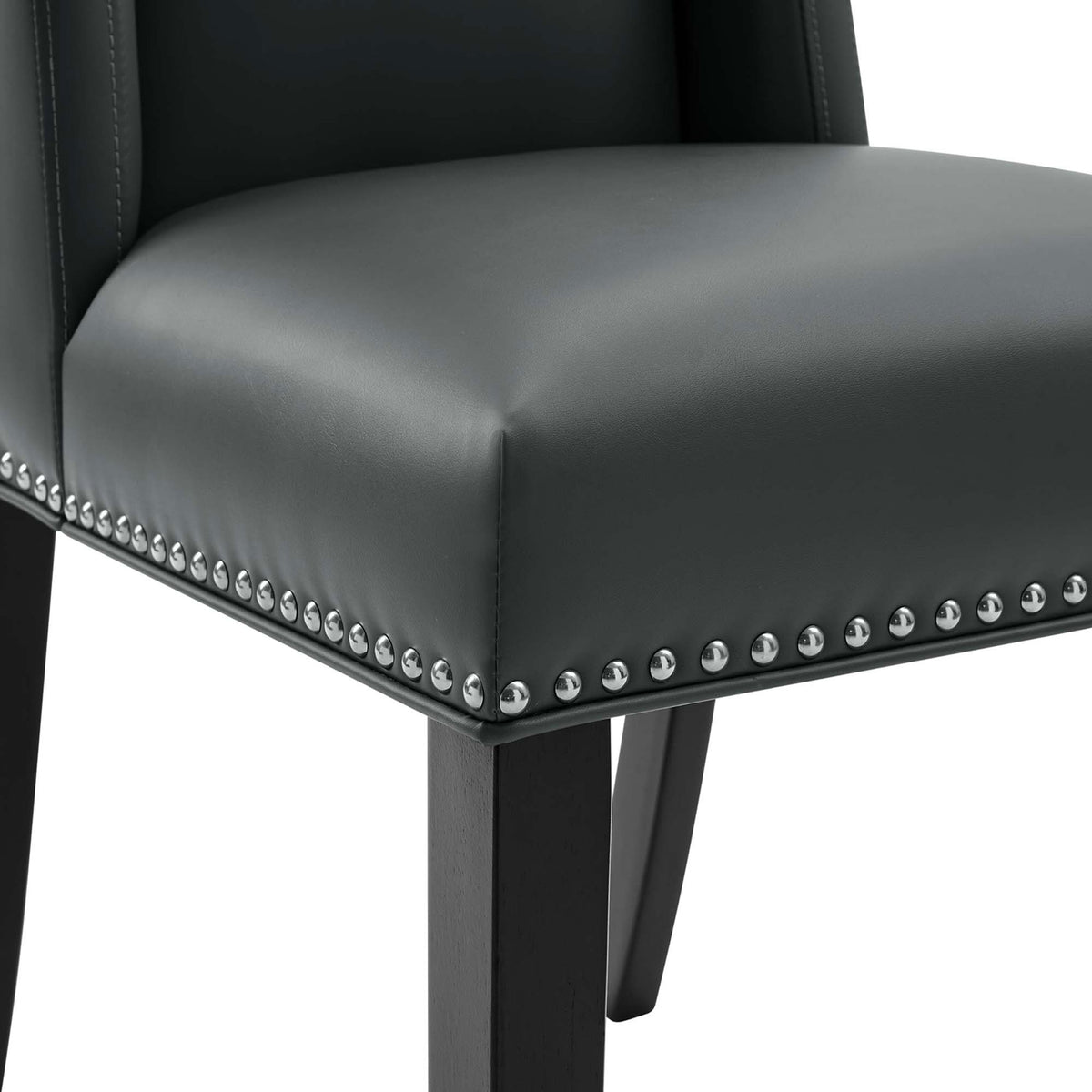 Nailhead trim and tailored stitching detail on the gray vegan leather dining chair seat || EEI-2232-GRY || detail_studio