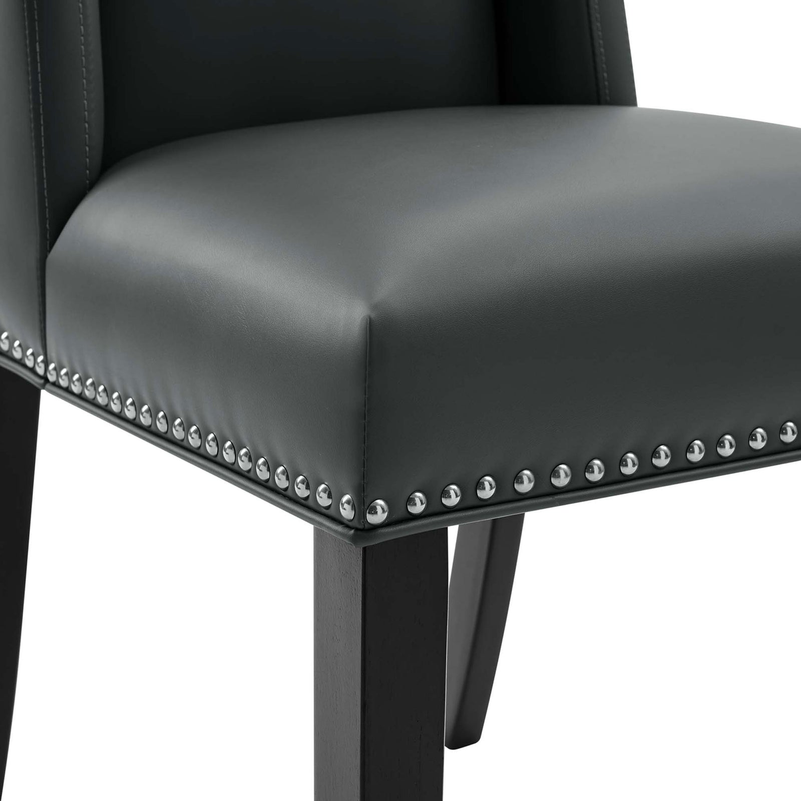Nailhead trim and tailored stitching detail on the gray vegan leather dining chair seat || EEI-2232-GRY || detail_studio