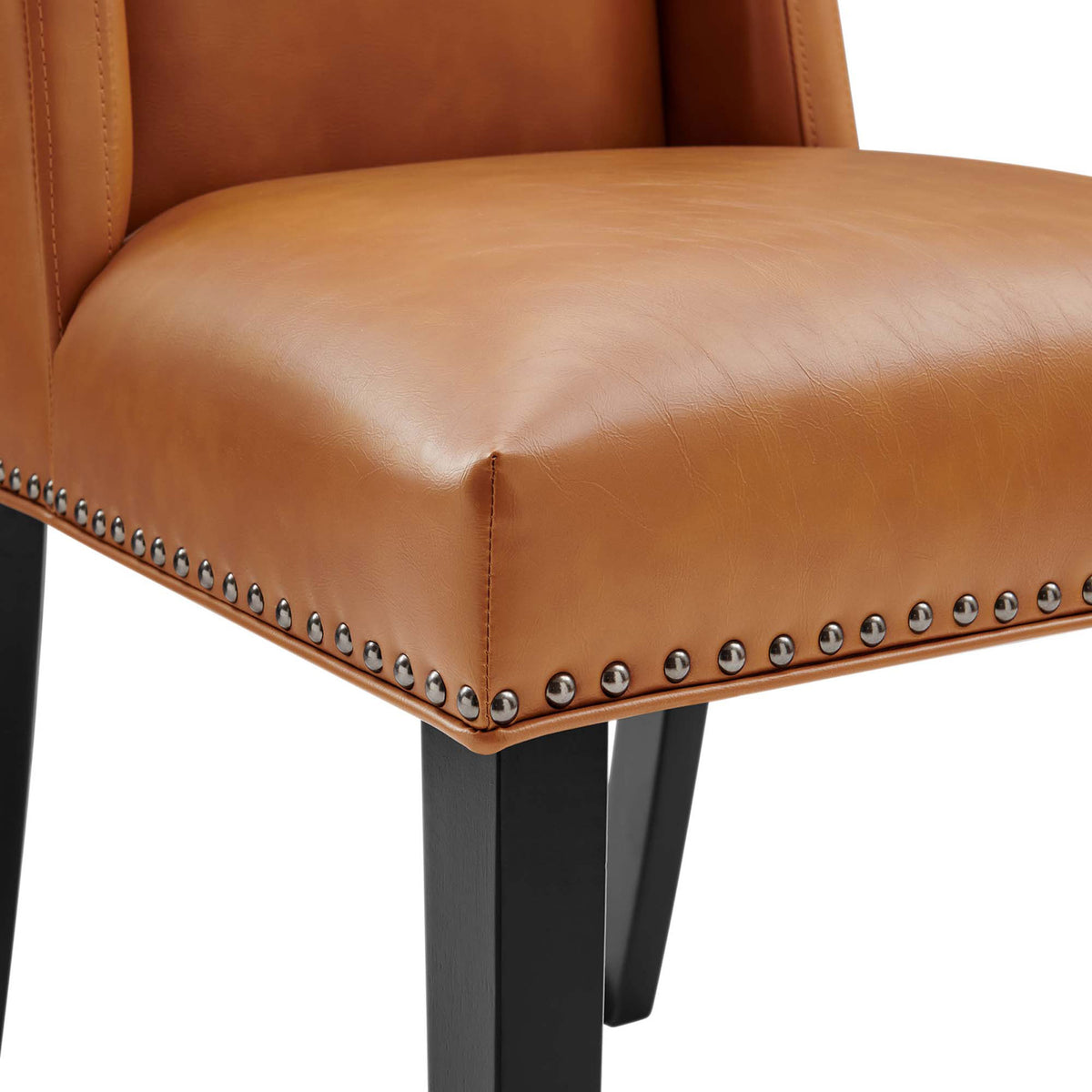 Padded tan seat shows off the nailhead trim and crisp tailoring along the front edge. || EEI-2232-TAN || detail_studio