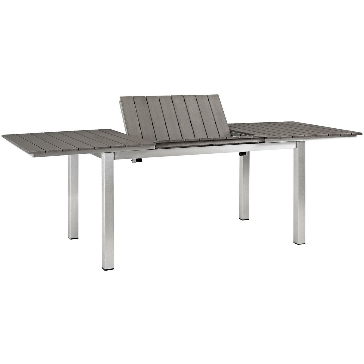 Outdoor extension dining table displaying its lift-up center leaf and smooth gray slatted surface || EEI-2257-SLV-GRY || front_angle_converted_studio
