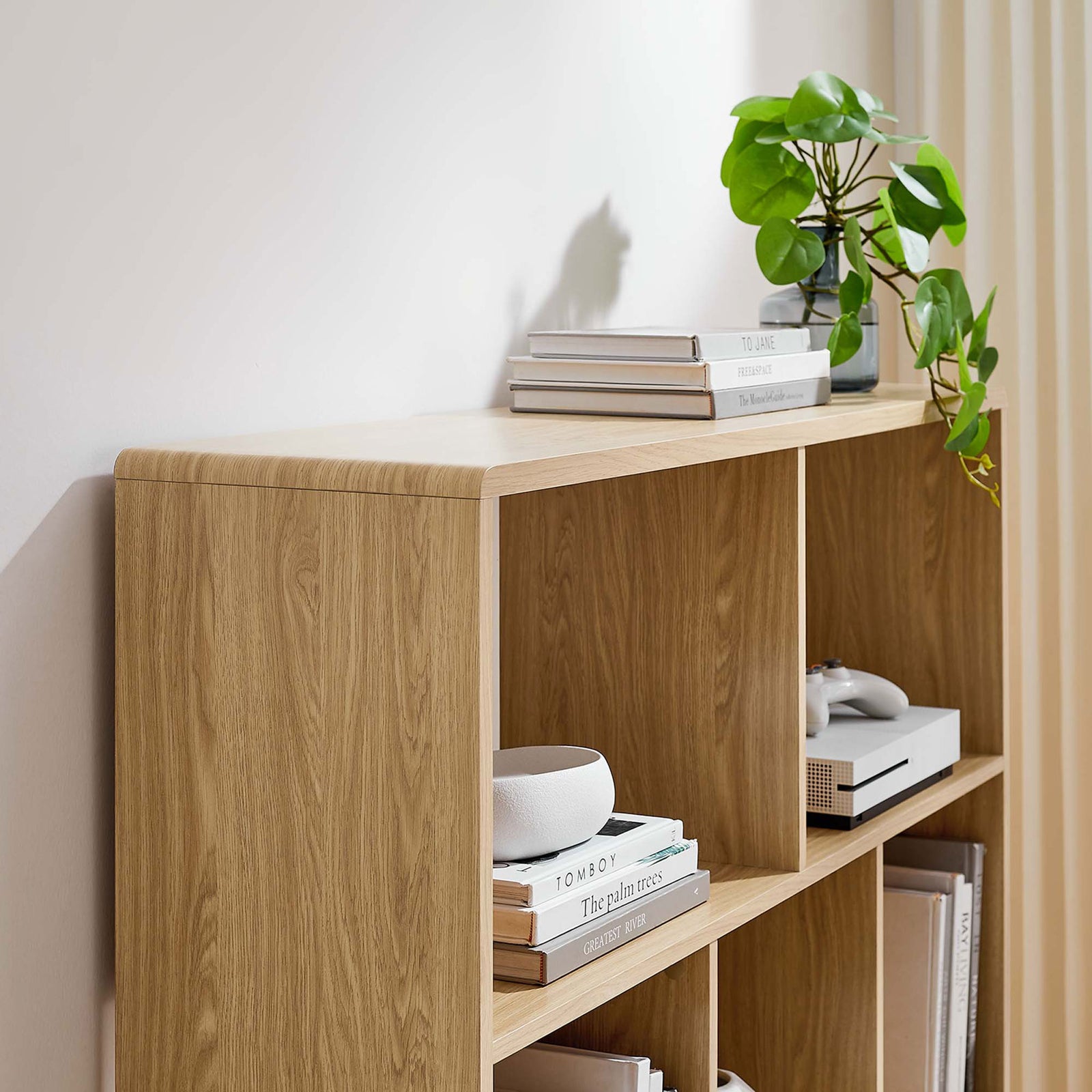 Rounded edges and open cubbies create a light, airy look for styled displays || EEI-2529-OAK || detail_room