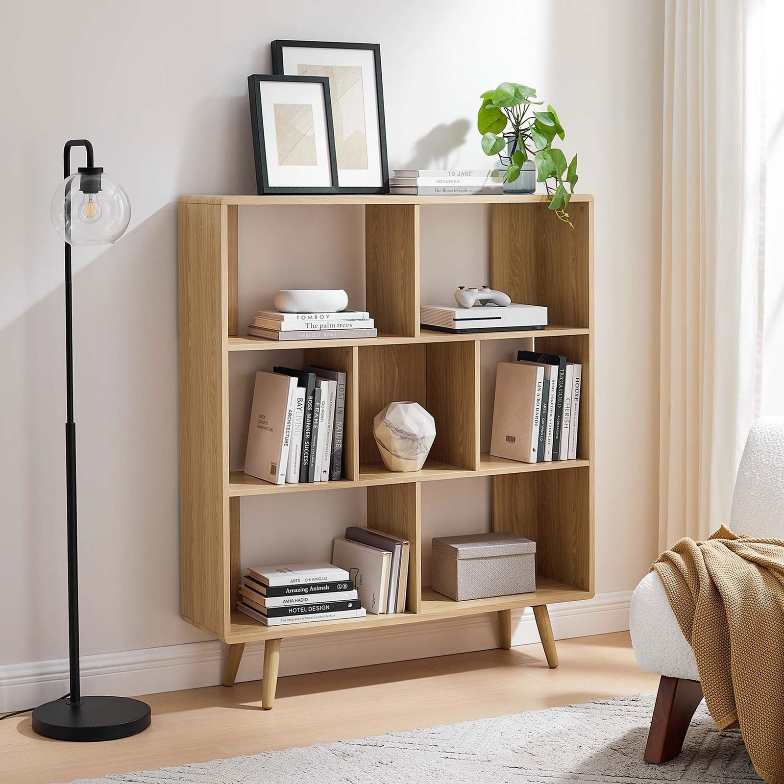 Oak bookcase elevates your space with seven versatile shelves and a warm, modern finish || EEI-2529-OAK || front_room