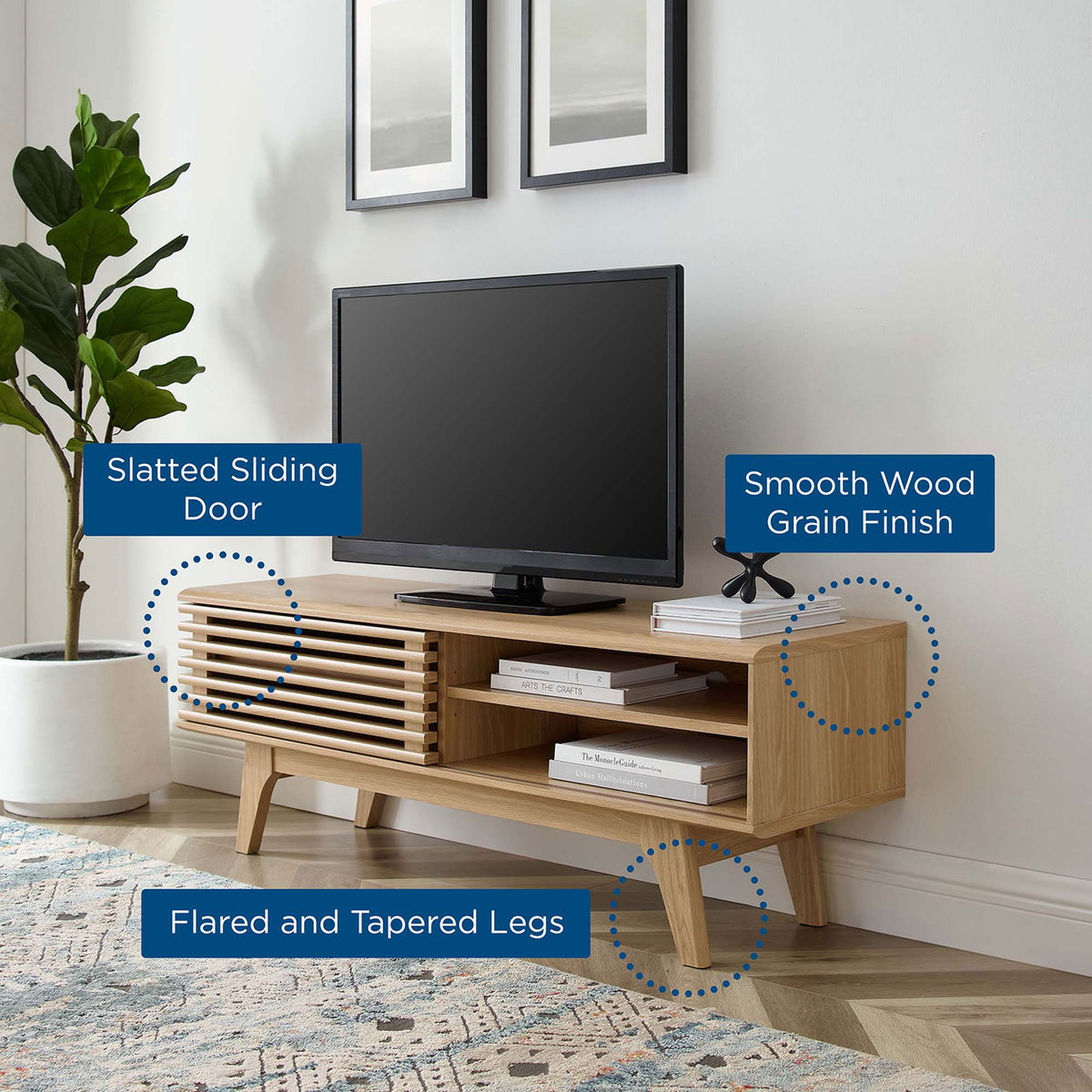 Room scene of oak TV stand with callouts for slatted sliding door, smooth wood grain, and flared legs || EEI-2539-OAK || callout_room