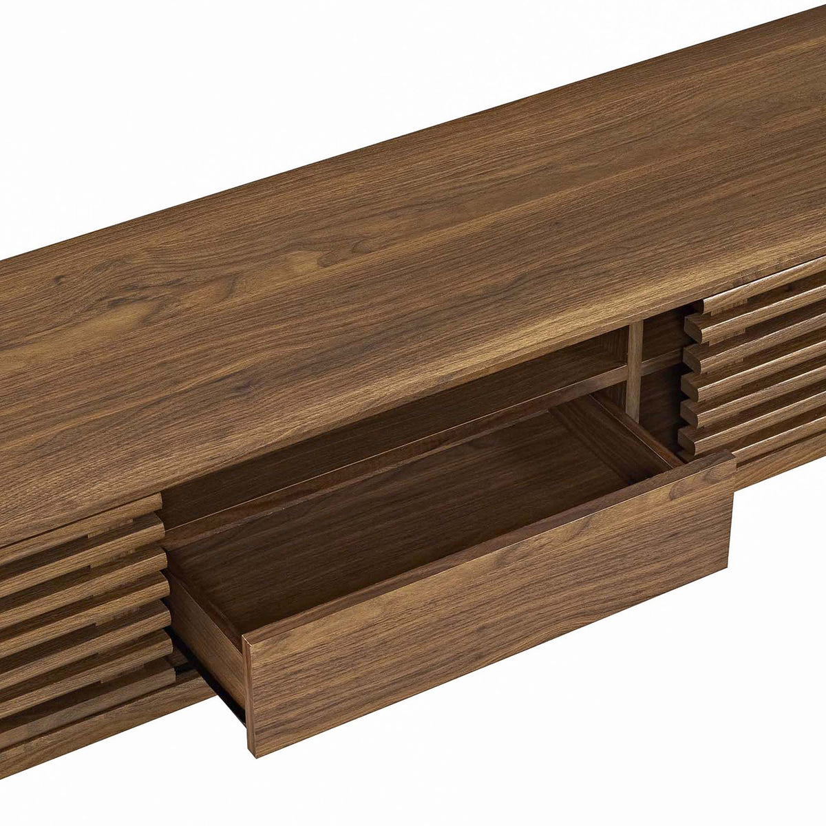 Open center drawer and shelf of walnut TV stand revealing smooth-glide storage space